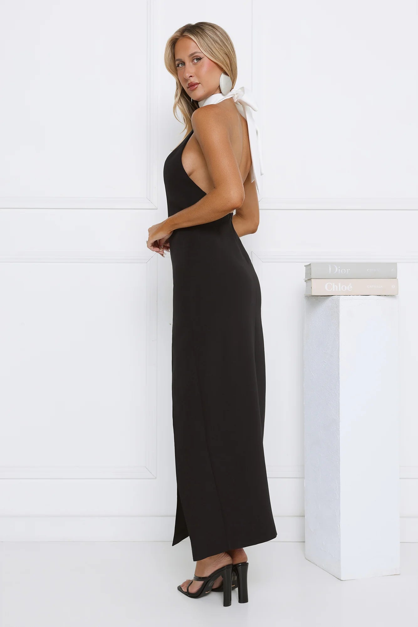 Elegant Black Halter Maxi Dress with Contrast White Bow Collar, Open Back, High Thigh Slit and Form-Fitting Silhouette
