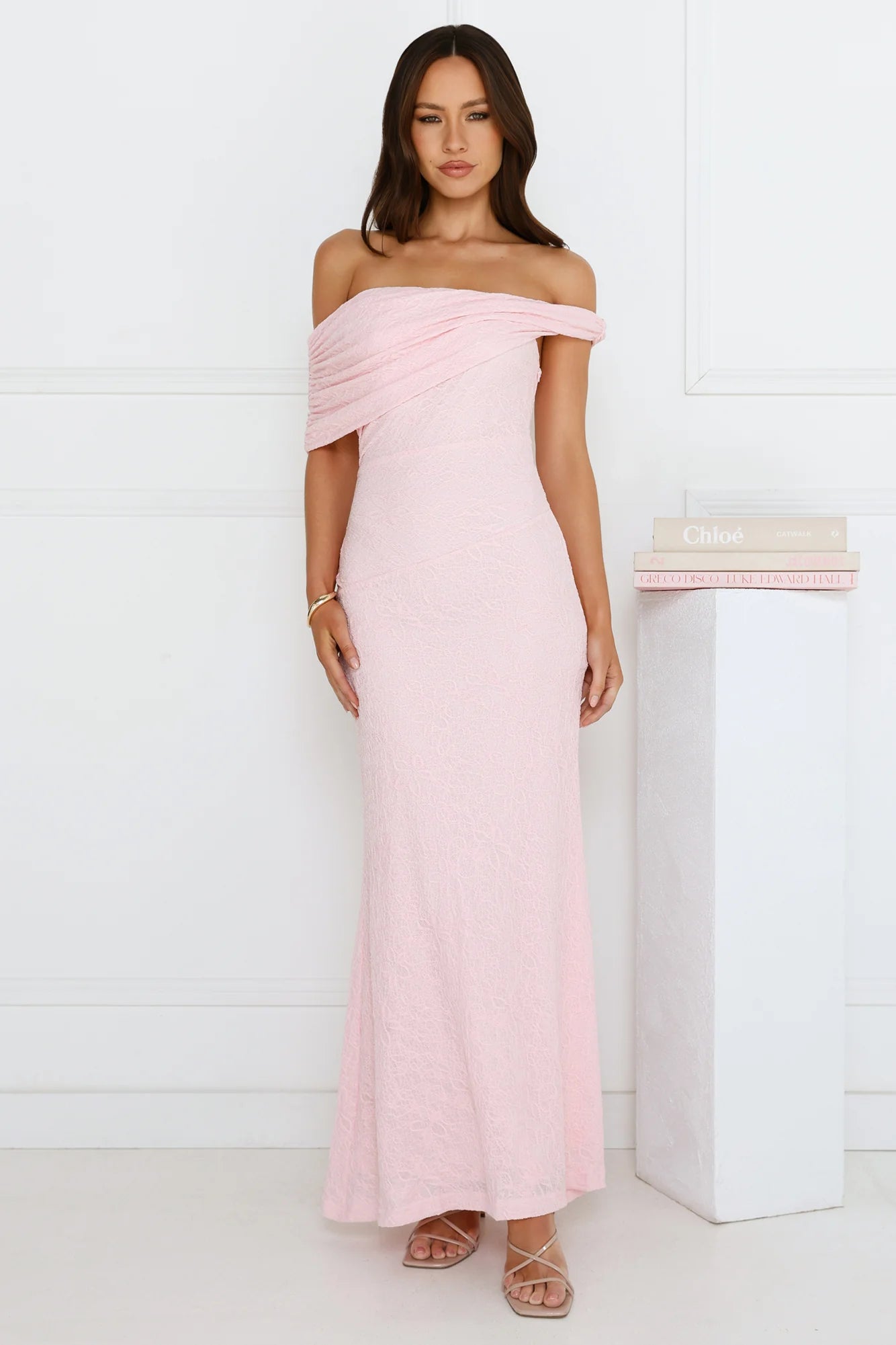 Elegant Blush Pink Off-the-Shoulder Maxi Dress with Draped Neckline, Textured Lace Fabric, Ruched Waist Detail and Flowy Mermaid Skirt