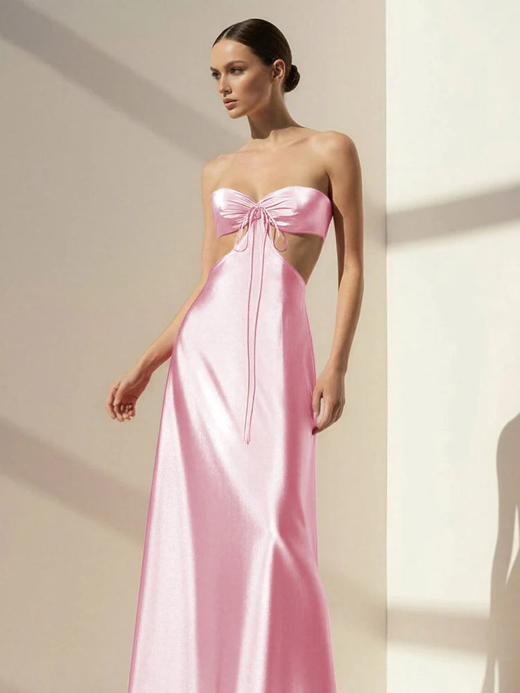 Elegant Blush Pink Satin Strapless Maxi Dress with Bow Accent, Side Cutout, Open Back Tie Closure and Flowing Floor-Length Skirt