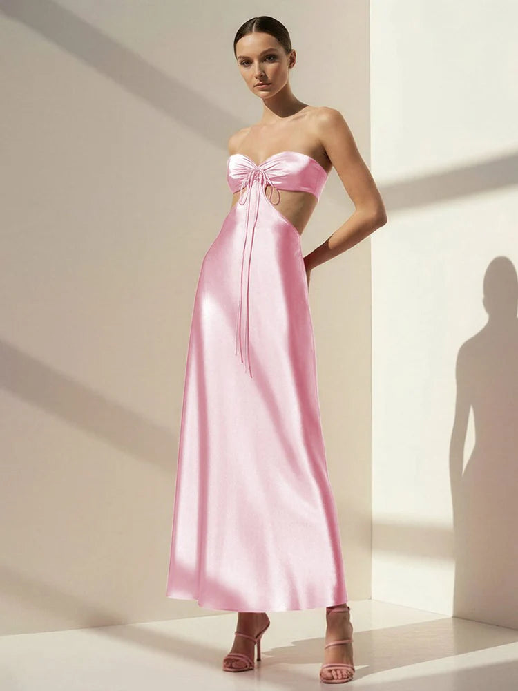 Elegant Blush Pink Satin Strapless Maxi Dress with Bow Accent, Side Cutout, Open Back Tie Closure and Flowing Floor-Length Skirt