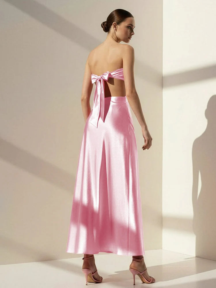 Elegant Blush Pink Satin Strapless Maxi Dress with Bow Accent, Side Cutout, Open Back Tie Closure and Flowing Floor-Length Skirt
