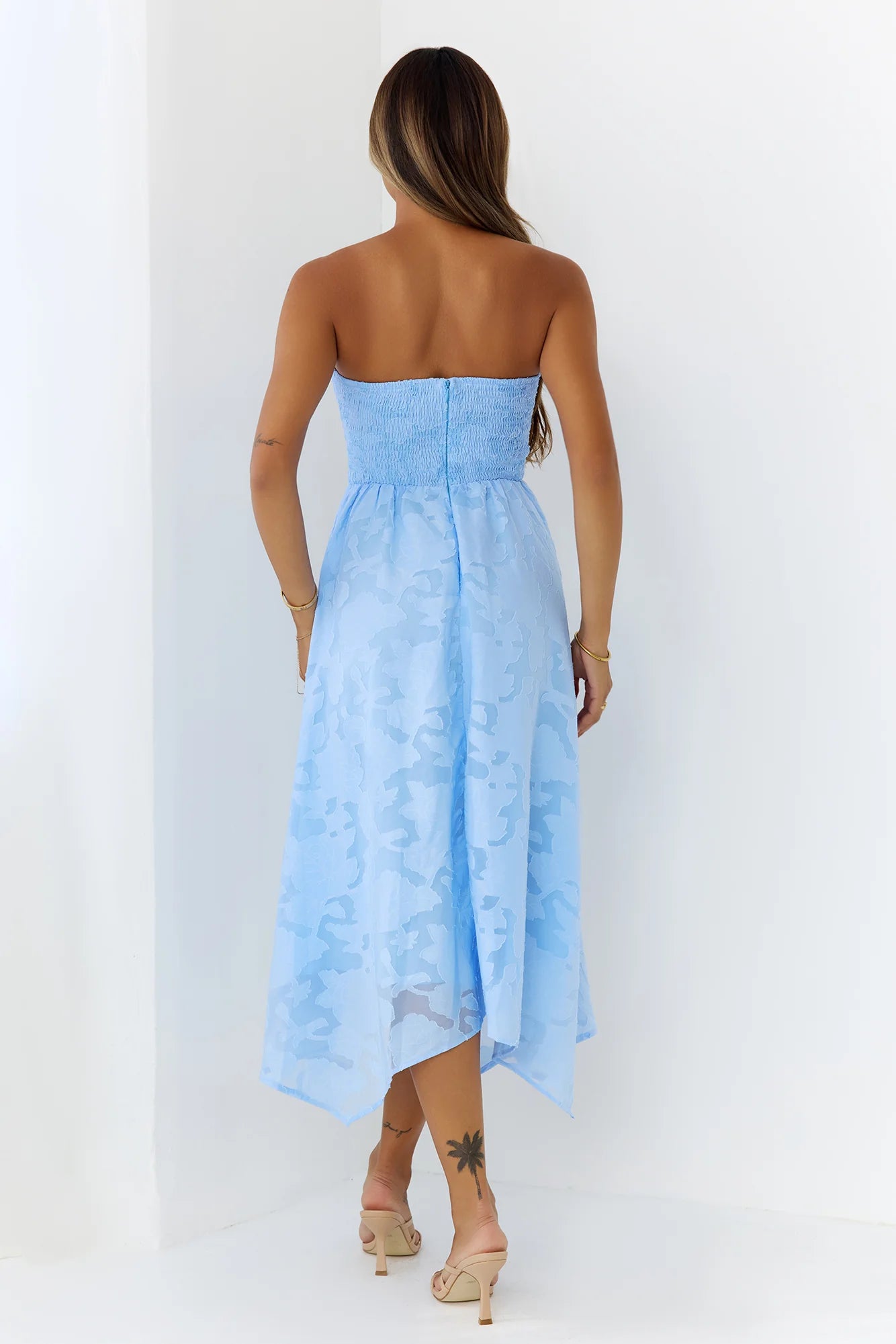 Elegant Sky Blue Strapless Midi Dress with Bow Accent, Floral Jacquard Texture, Smocked Back Panel and Asymmetrical Handkerchief Hem