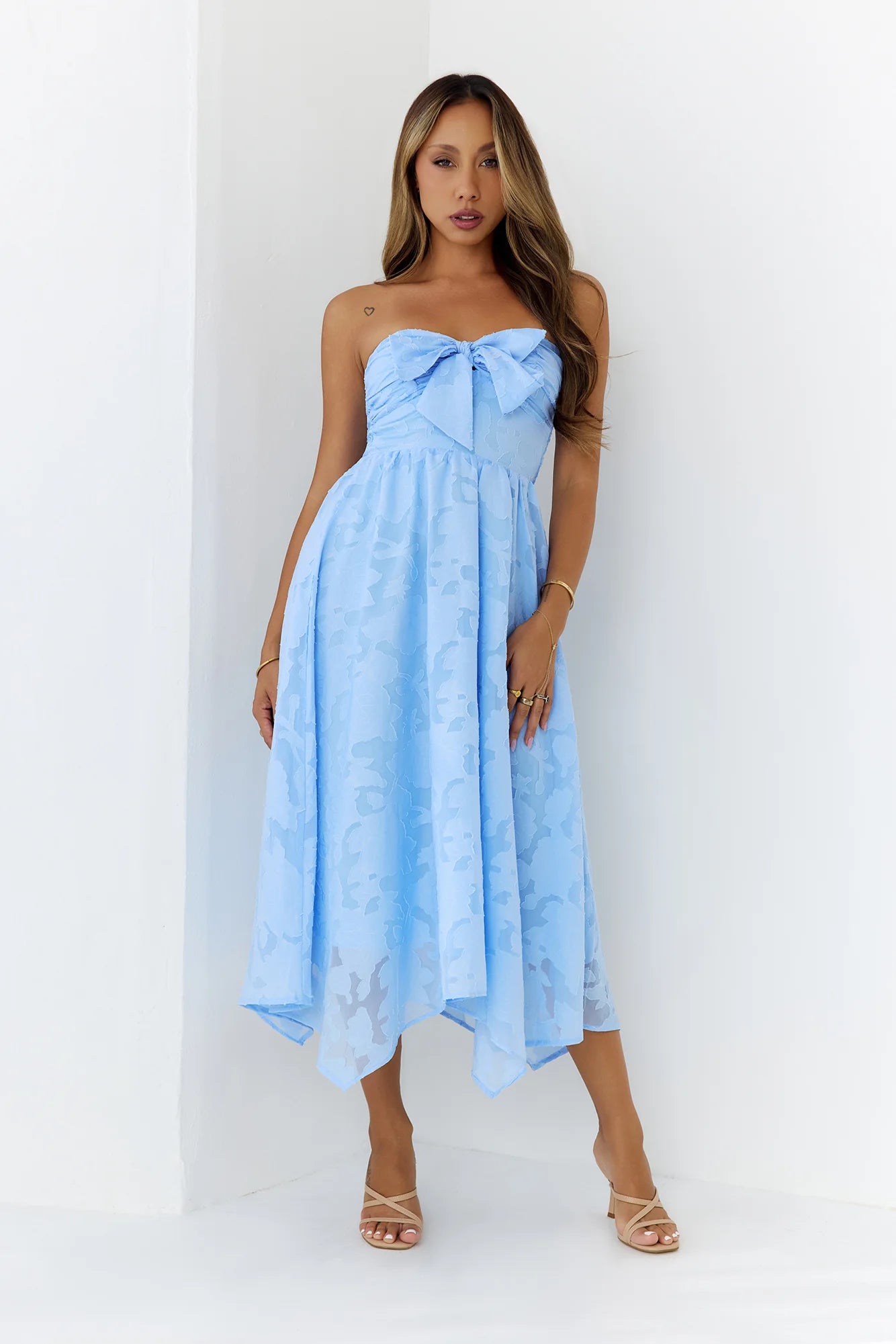 Elegant Sky Blue Strapless Midi Dress with Bow Accent, Floral Jacquard Texture, Smocked Back Panel and Asymmetrical Handkerchief Hem