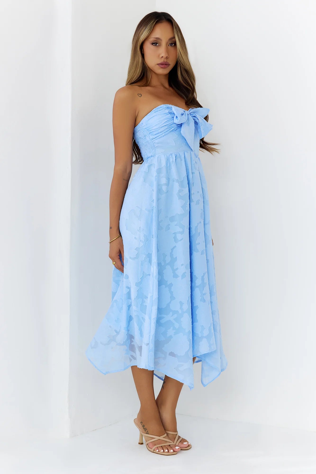 Elegant Sky Blue Strapless Midi Dress with Bow Accent, Floral Jacquard Texture, Smocked Back Panel and Asymmetrical Handkerchief Hem