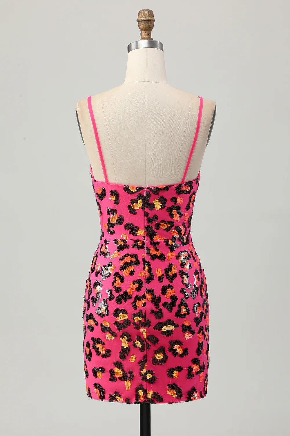 Back view of fuchsia leopard sequin tight mini dress with spaghetti straps.