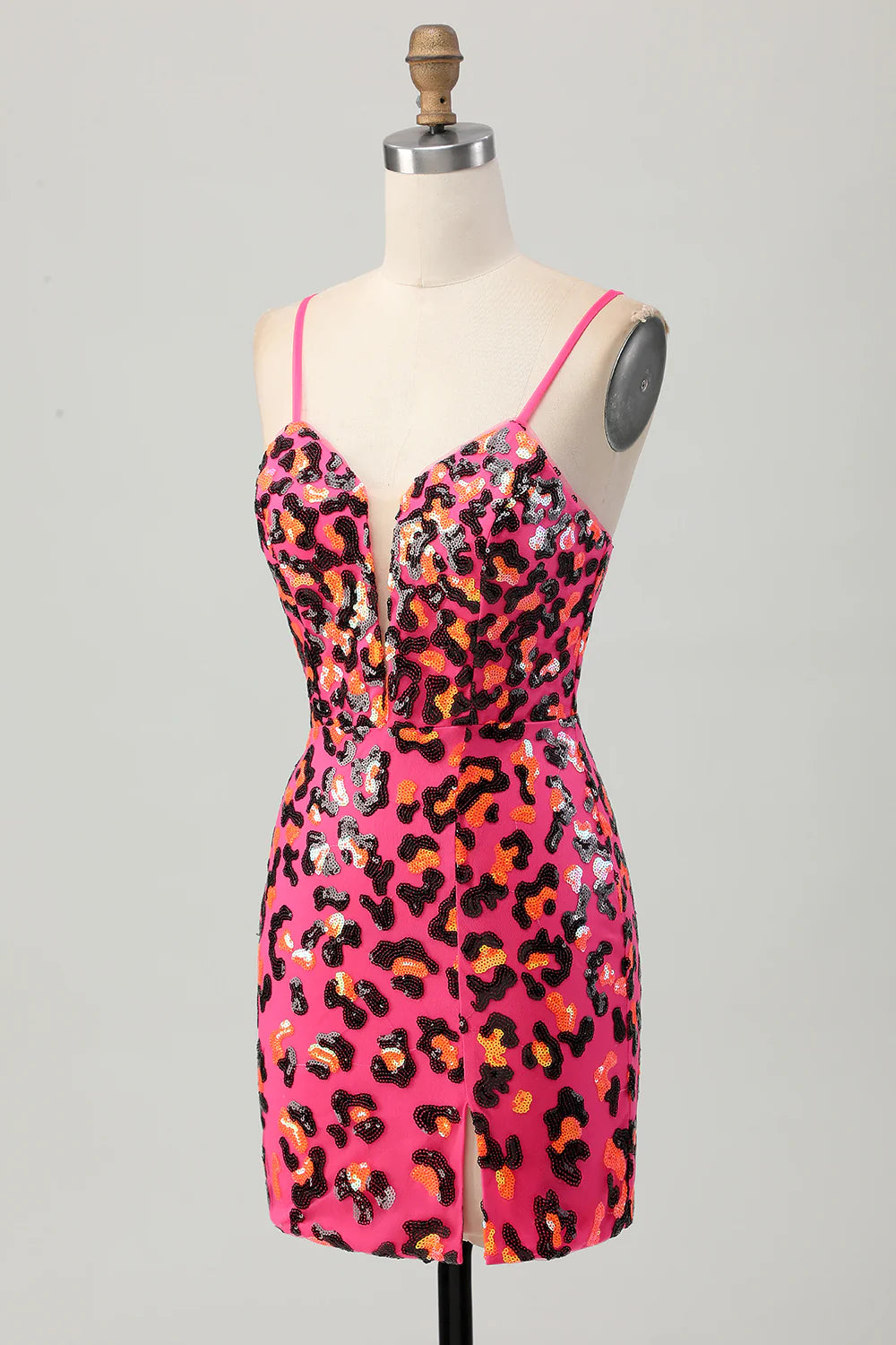 Side view of fuchsia leopard sequin mini dress showing the slit and tight fit.