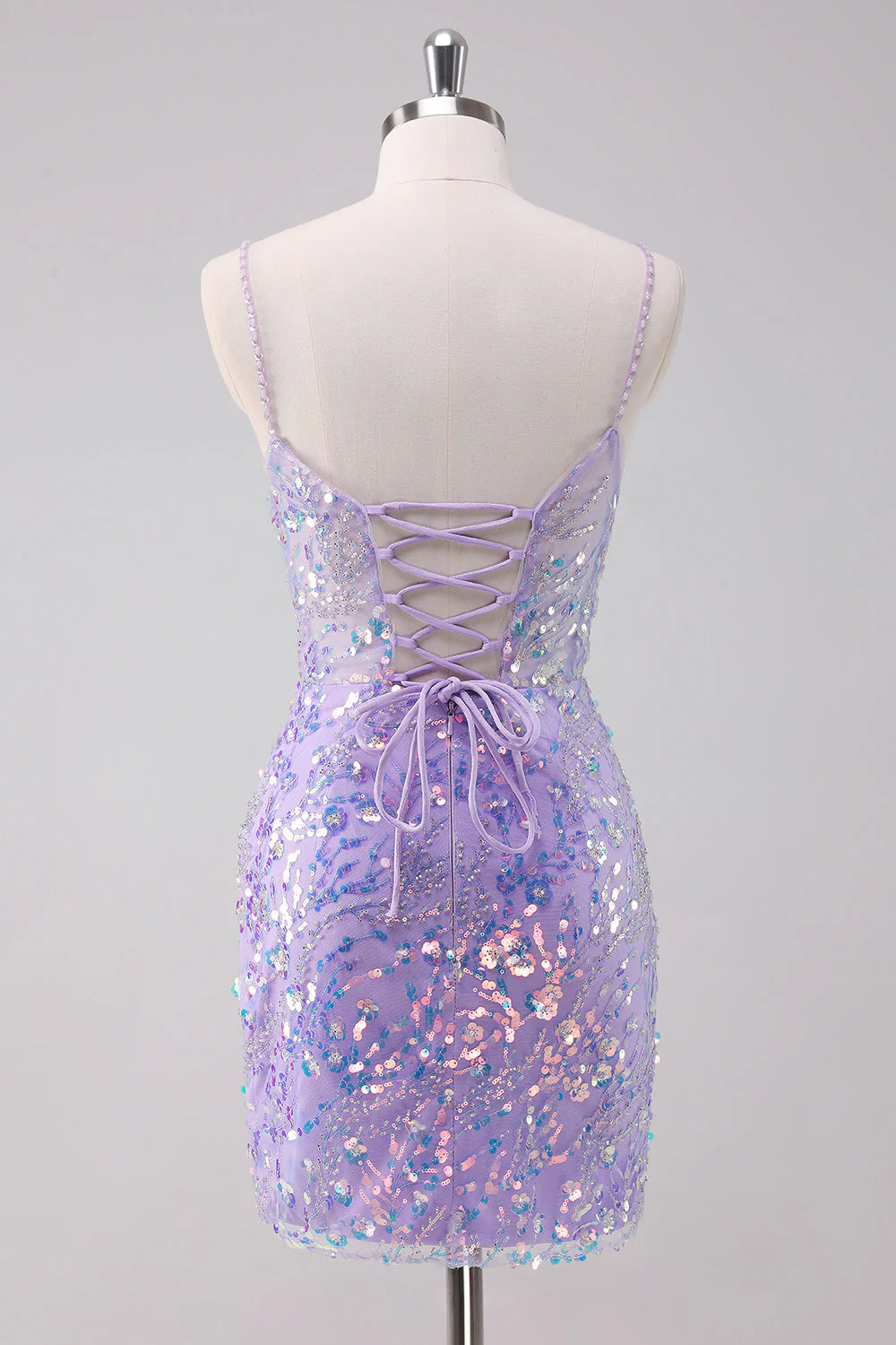 Back view of the purple sequin bodycon homecoming dress, showing its short length.