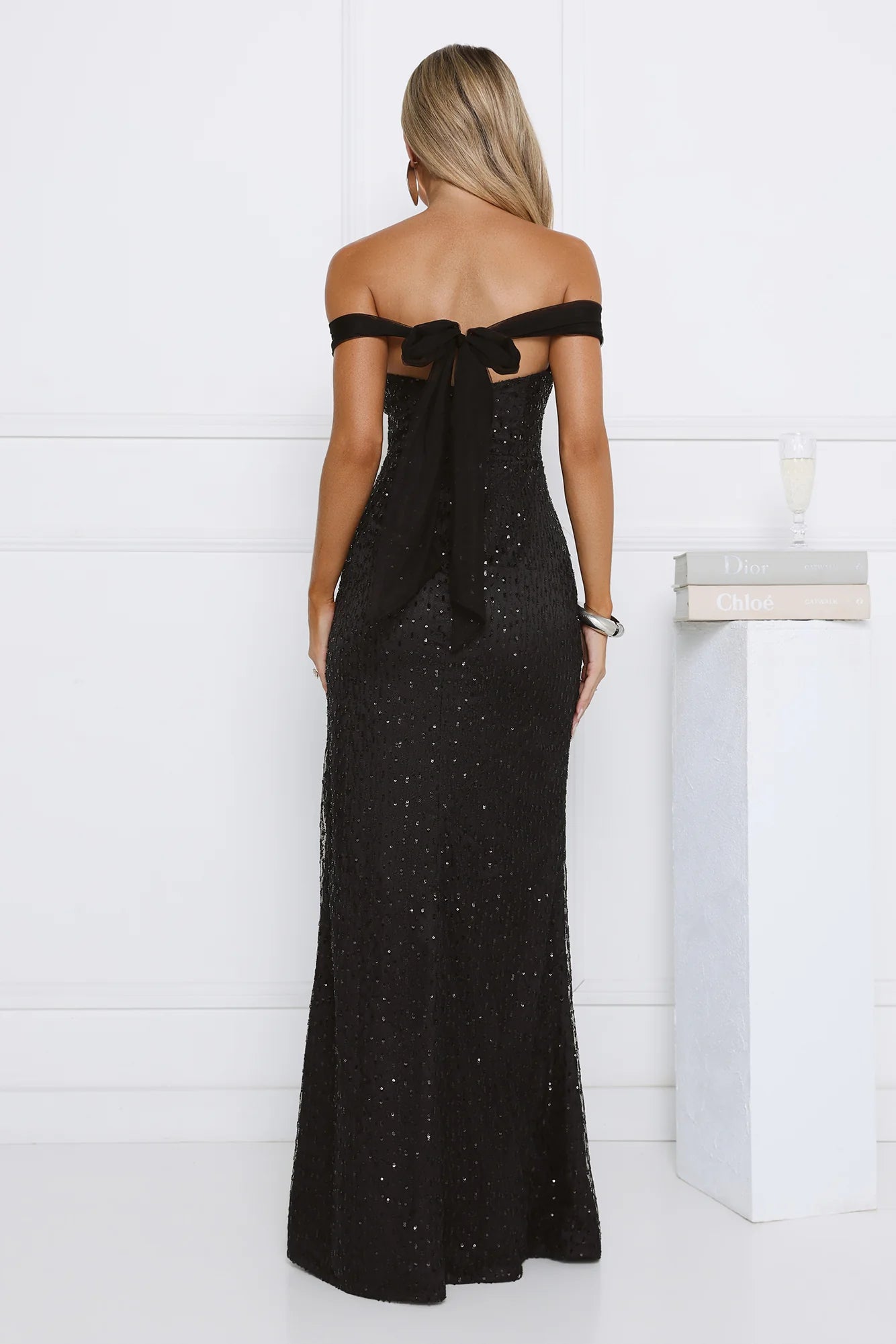 Glamorous Black Off-the-Shoulder Sequin Maxi Dress with Sweetheart Neckline, Back Bow Tie Closure, High Thigh Slit and Form-Fitting Silhouette