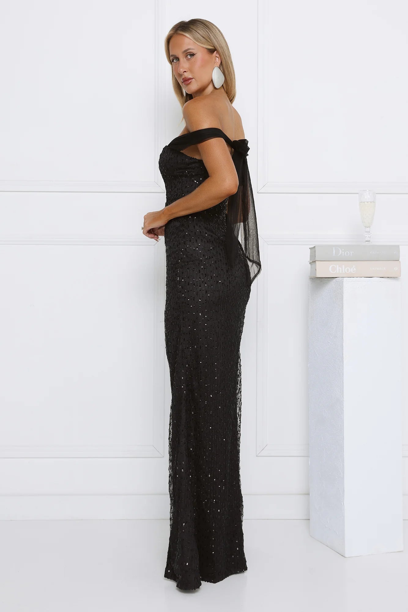Glamorous Black Off-the-Shoulder Sequin Maxi Dress with Sweetheart Neckline, Back Bow Tie Closure, High Thigh Slit and Form-Fitting Silhouette