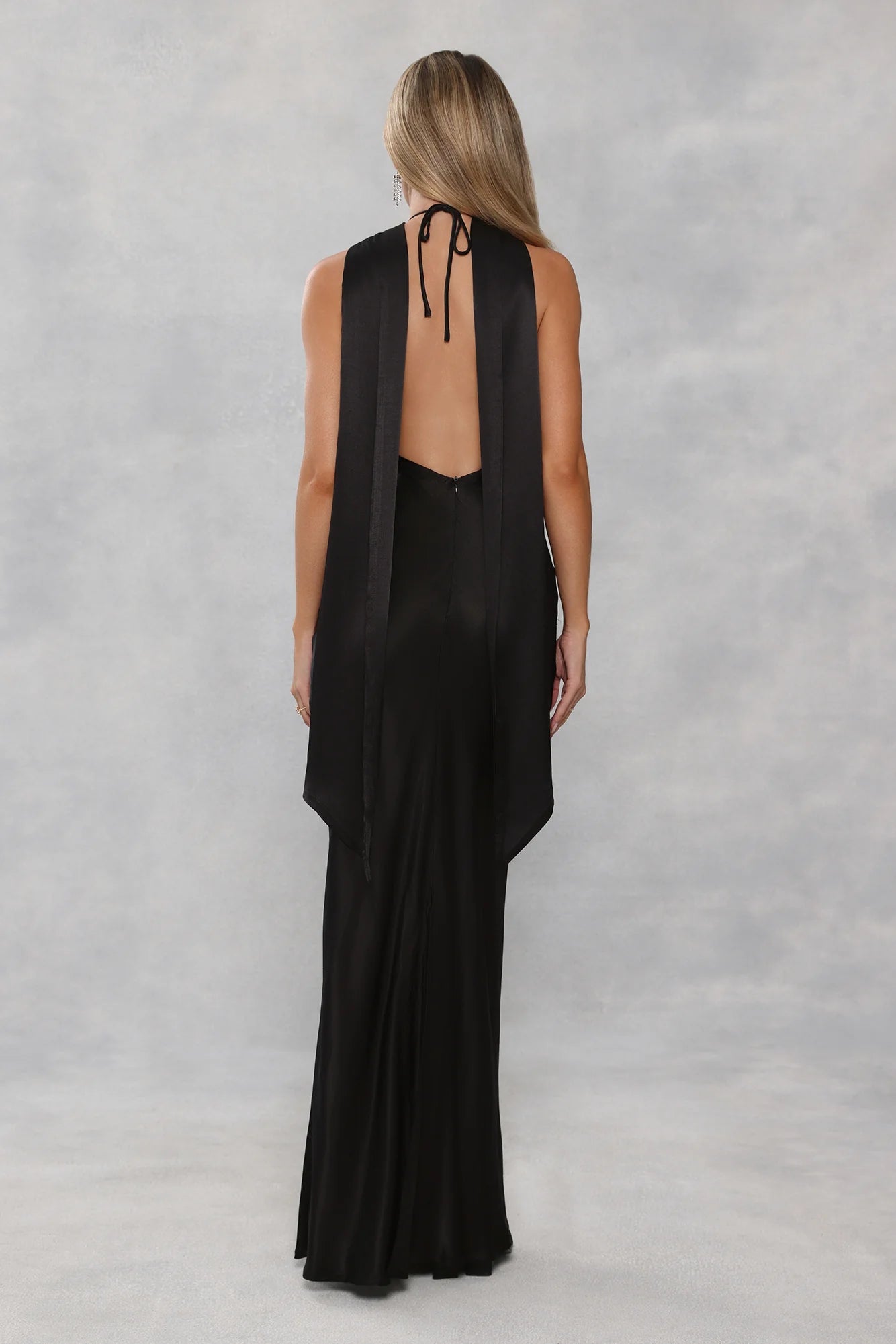 Glamorous Black Satin Halter Neck Maxi Dress with High Neck Draped Cape Overlay, Open Back Tie Closure, Form-Fitting Mermaid Silhouette and Floor-Length Flowing Skirt