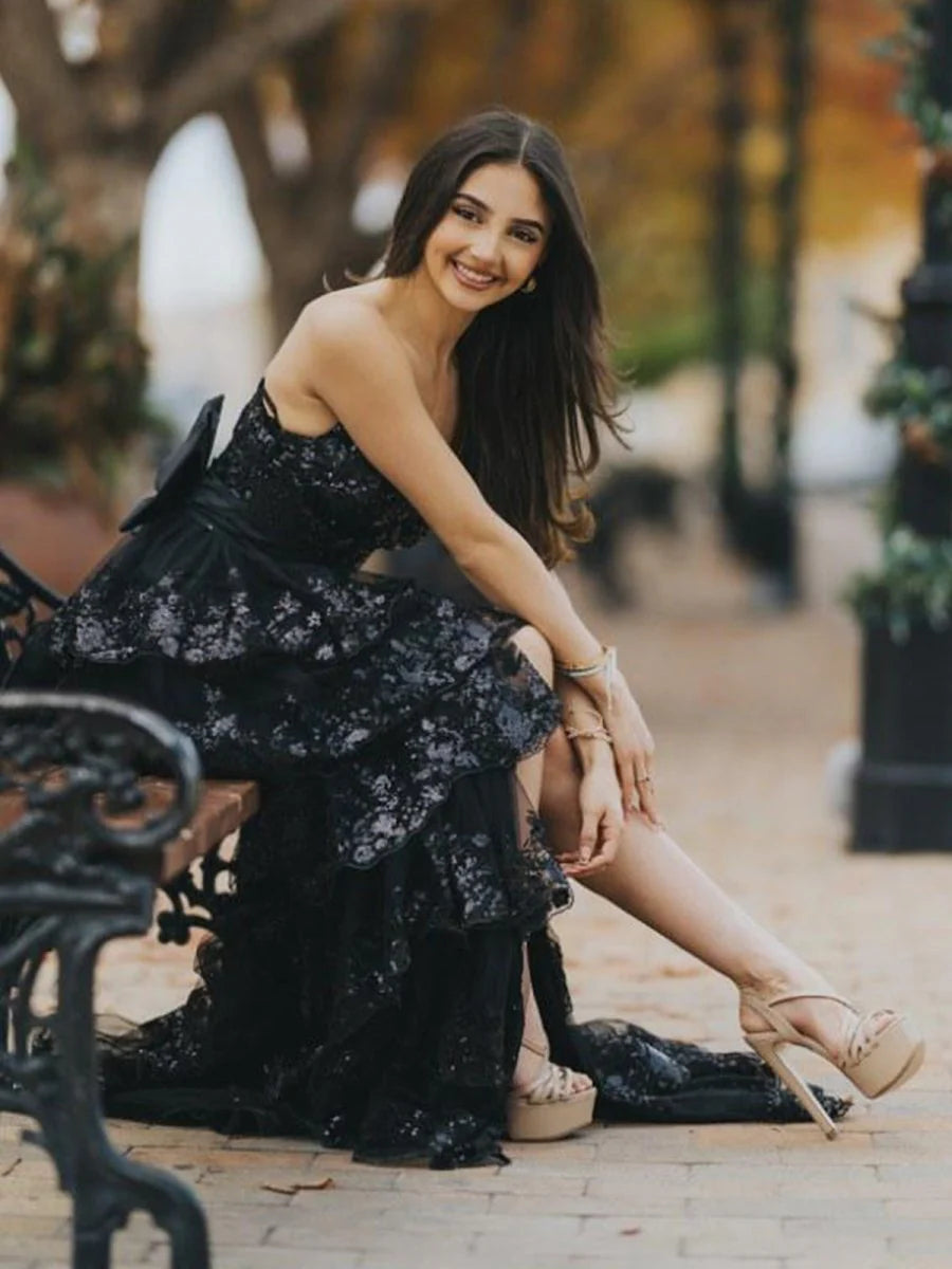 Glamorous Black Strapless Evening Gown with Sequin Embellished Bodice, Tiered Ruffle Tulle Skirt, Oversized Back Bow and High Thigh Slit