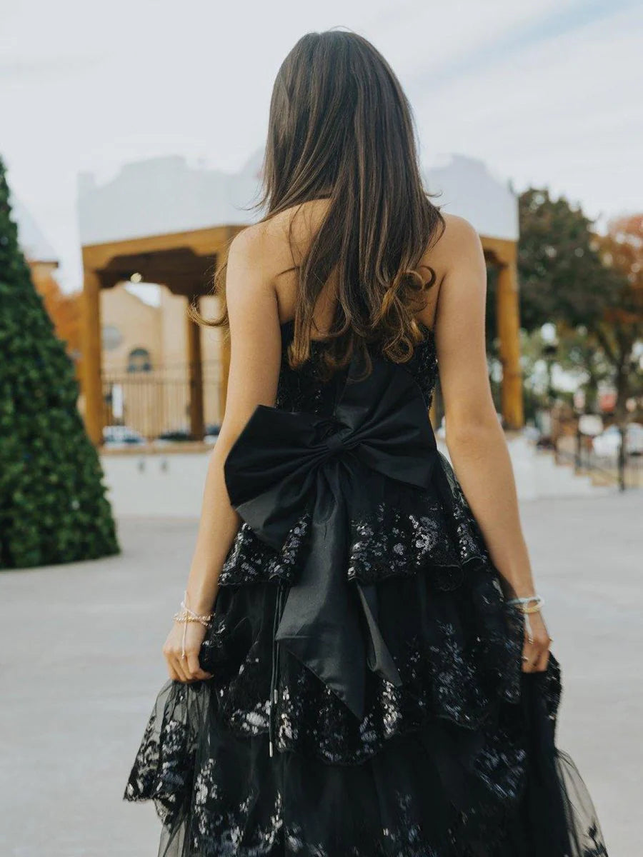 Glamorous Black Strapless Evening Gown with Sequin Embellished Bodice, Tiered Ruffle Tulle Skirt, Oversized Back Bow and High Thigh Slit