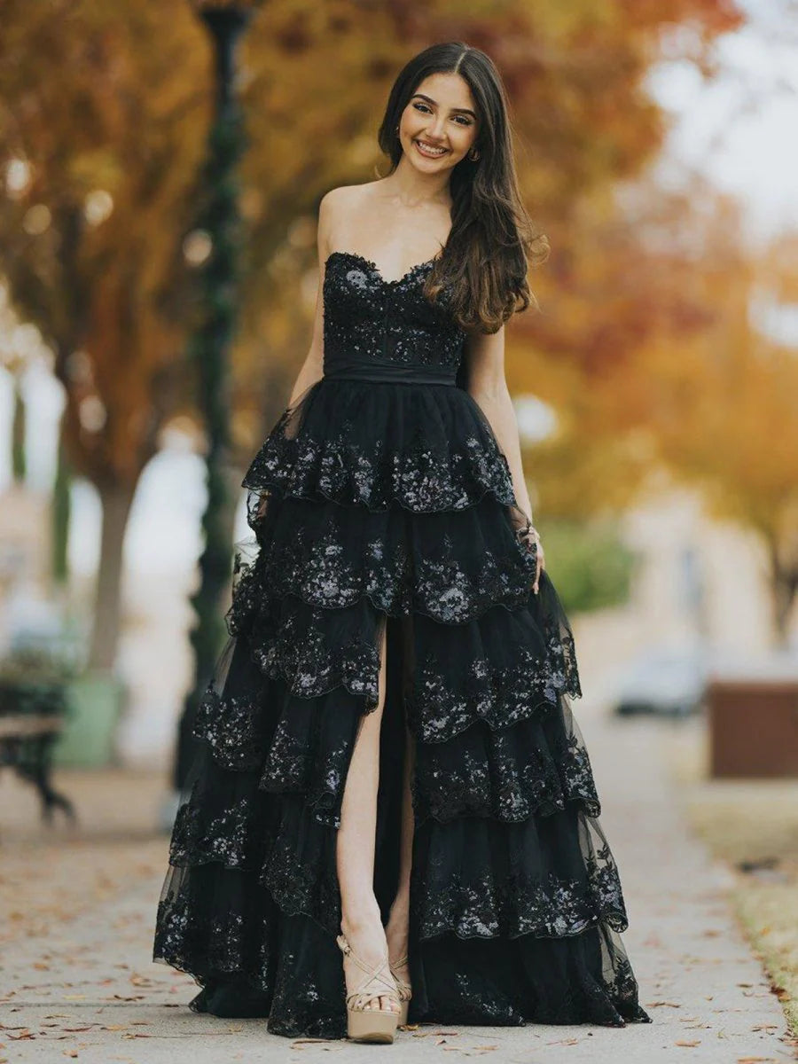 Glamorous Black Strapless Evening Gown with Sequin Embellished Bodice, Tiered Ruffle Tulle Skirt, Oversized Back Bow and High Thigh Slit