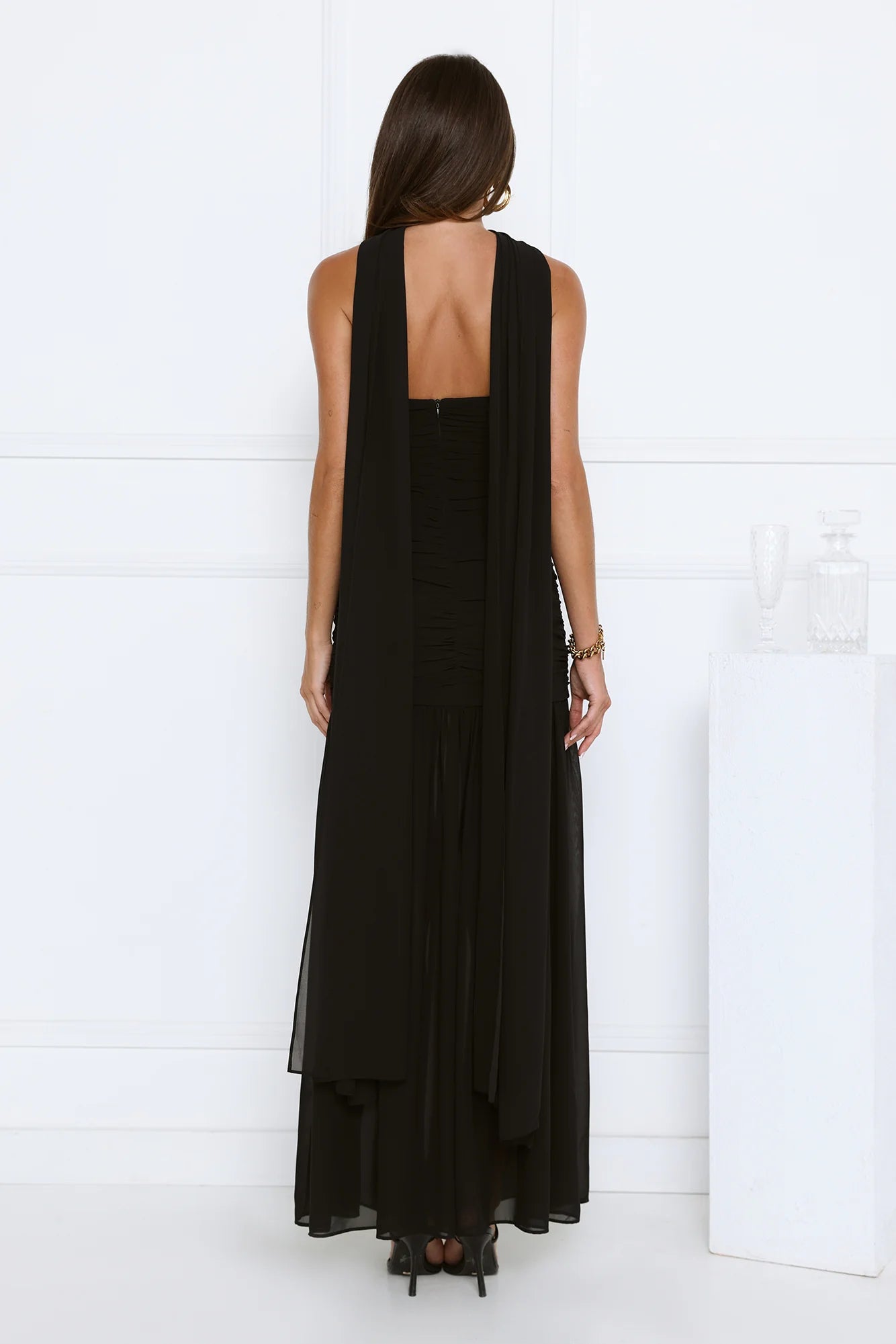 Glamorous Black Strapless Maxi Dress with High Neck Draped Sash Detail, Ruched Waist Accent, Open Back Design and Flowy Chiffon Mermaid Skirt