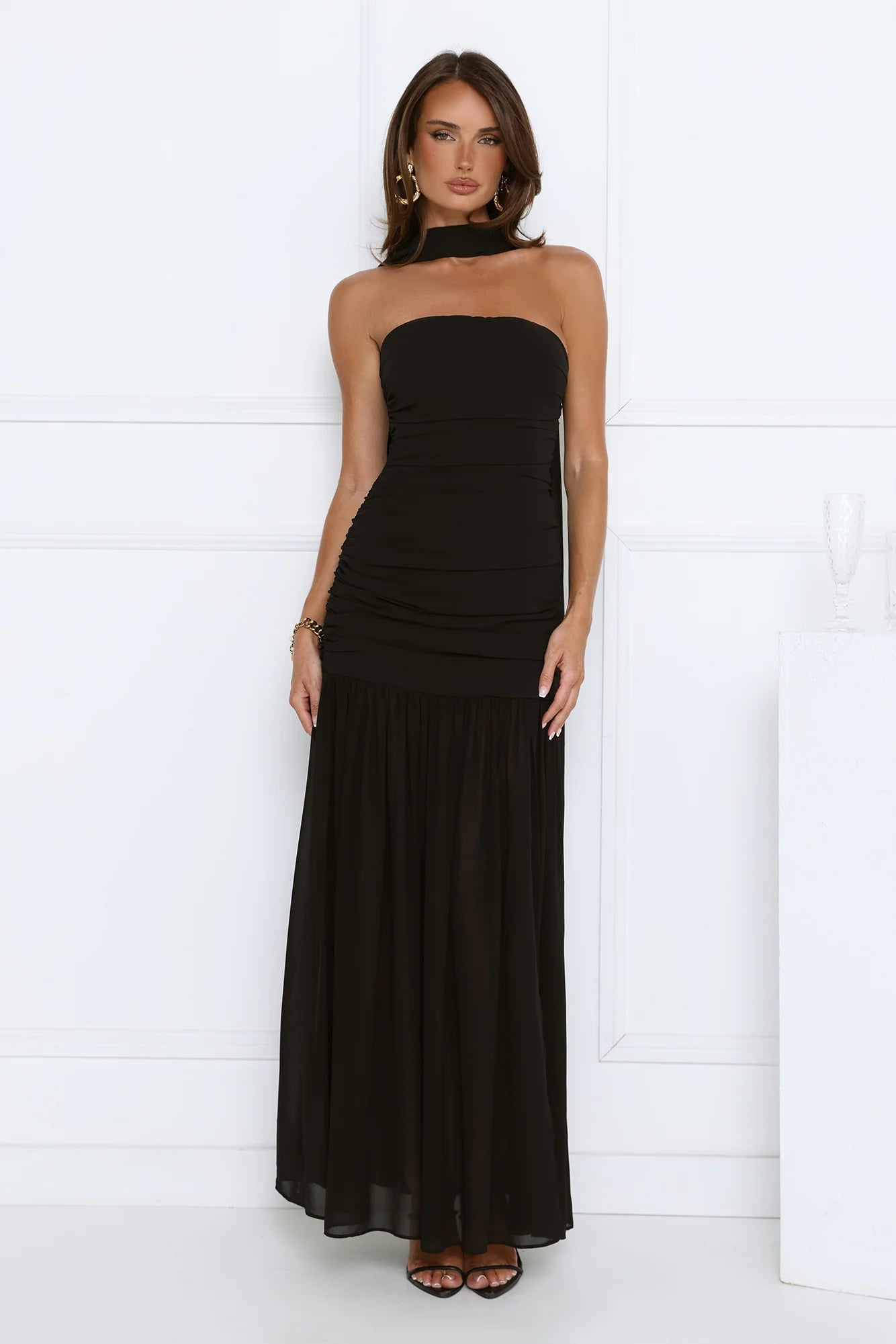 Glamorous Black Strapless Maxi Dress with High Neck Draped Sash Detail, Ruched Waist Accent, Open Back Design and Flowy Chiffon Mermaid Skirt