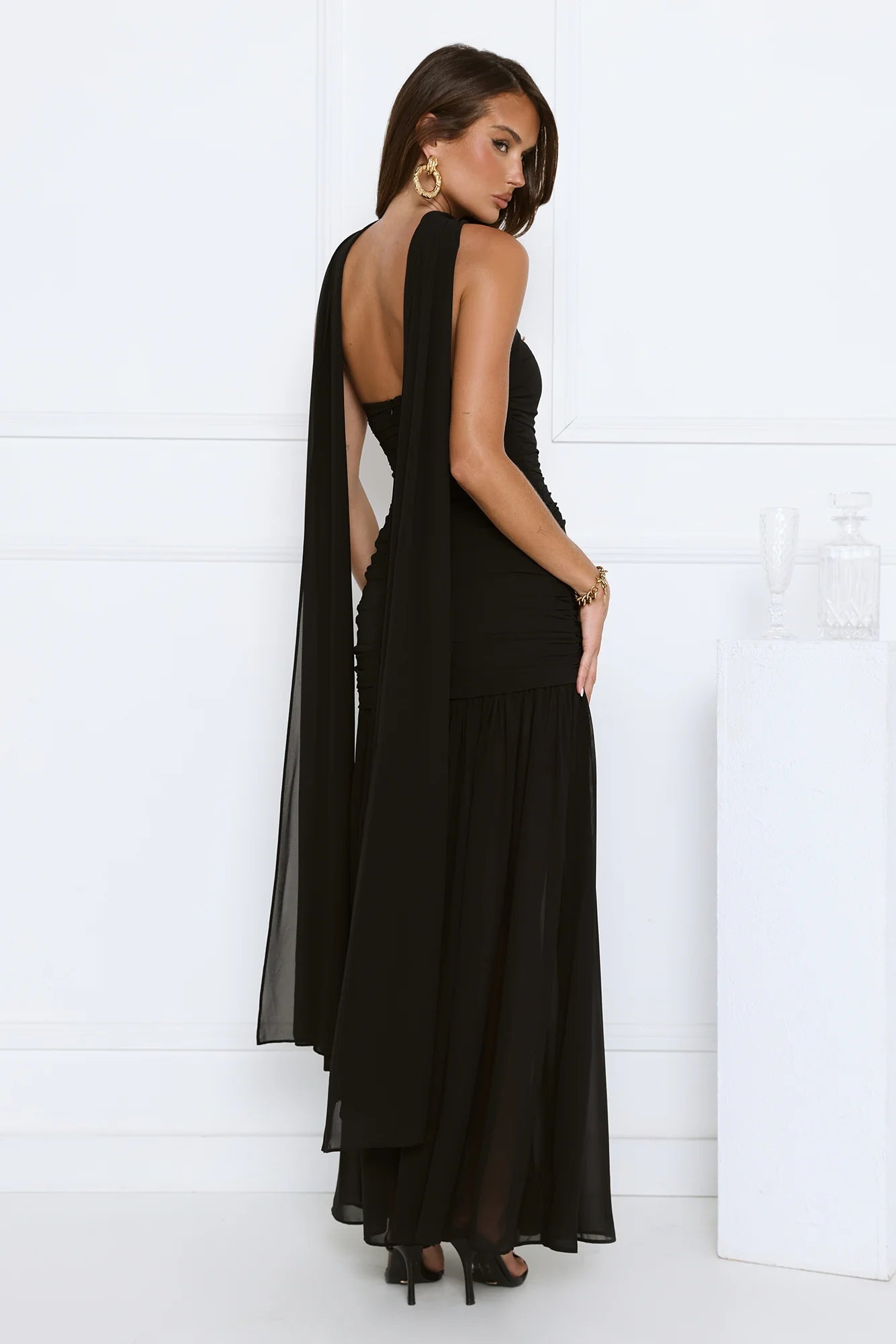Glamorous Black Strapless Maxi Dress with High Neck Draped Sash Detail, Ruched Waist Accent, Open Back Design and Flowy Chiffon Mermaid Skirt
