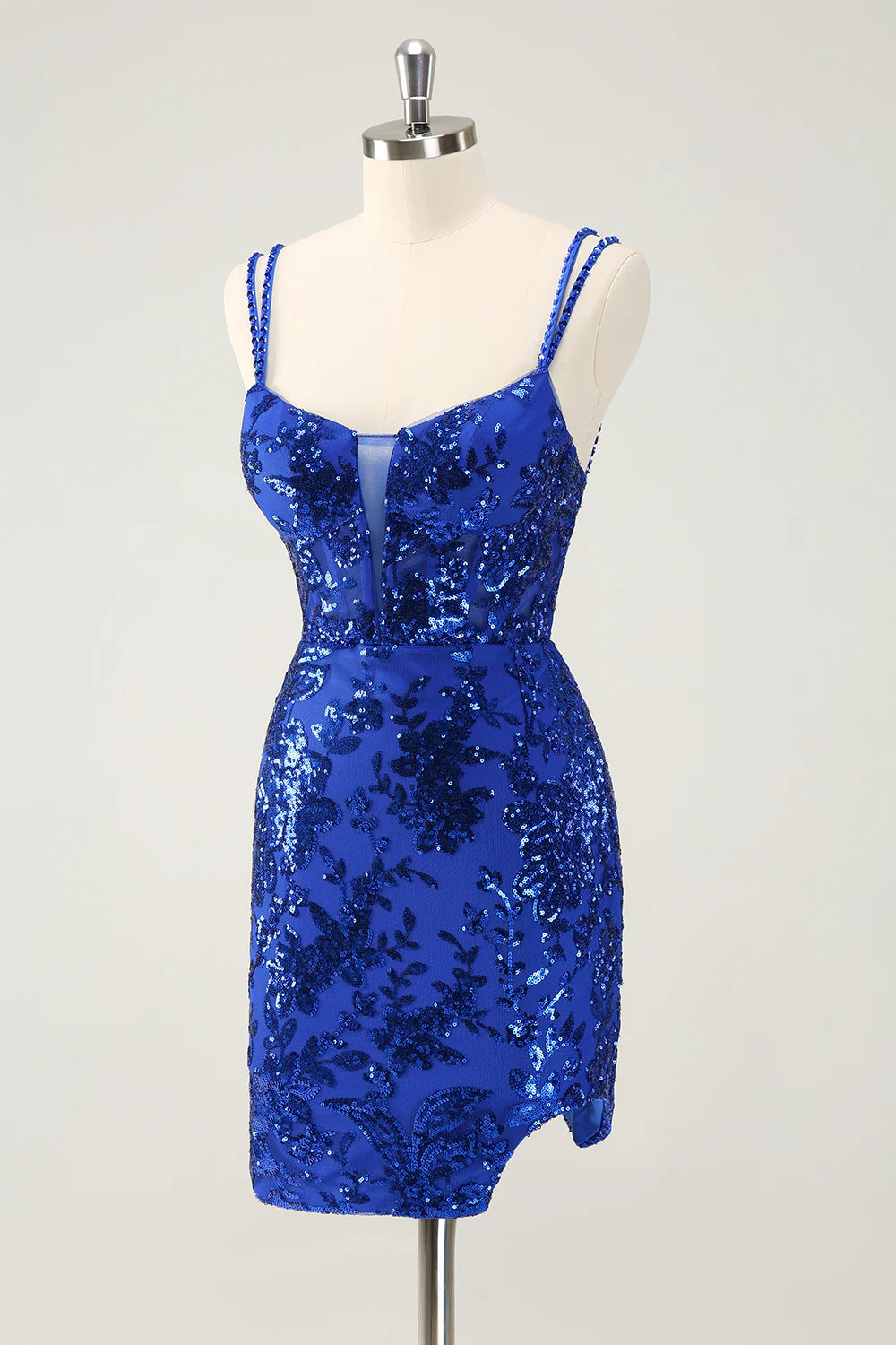 Close-up of the V-neck and glitter fabric on a royal blue homecoming dress.