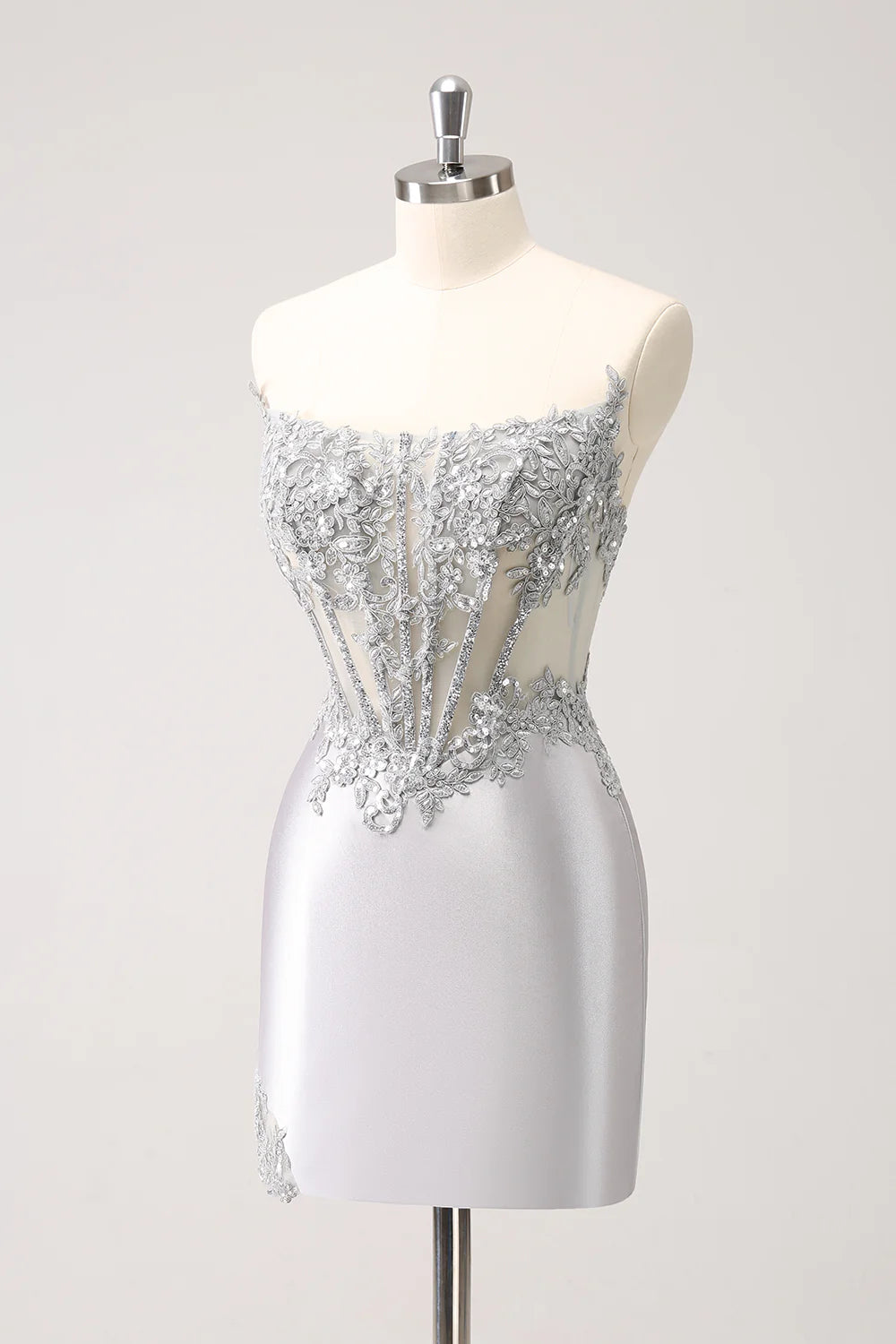 Side profile of the A-line silver homecoming dress, highlighting the fabric.