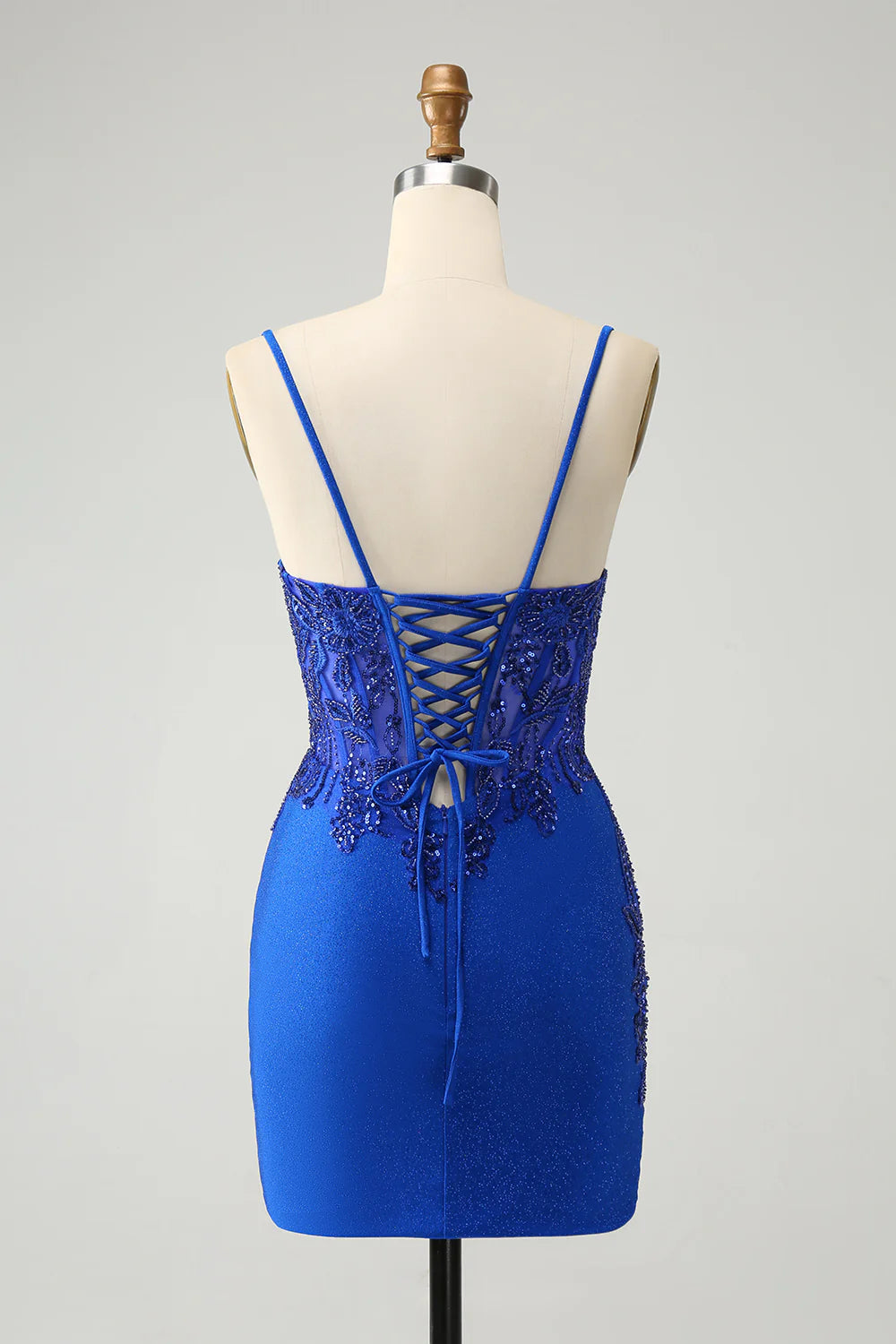 Side view of royal blue glitter A-line dress, showing flowing ankle-length skirt.