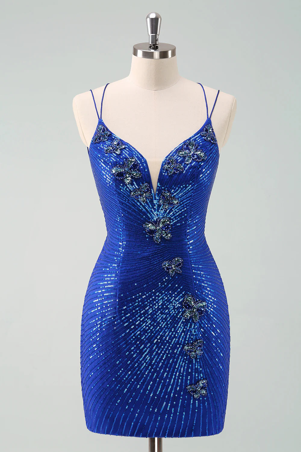 Model wearing a royal blue glitter A-line homecoming dress with sequin butterflies.
