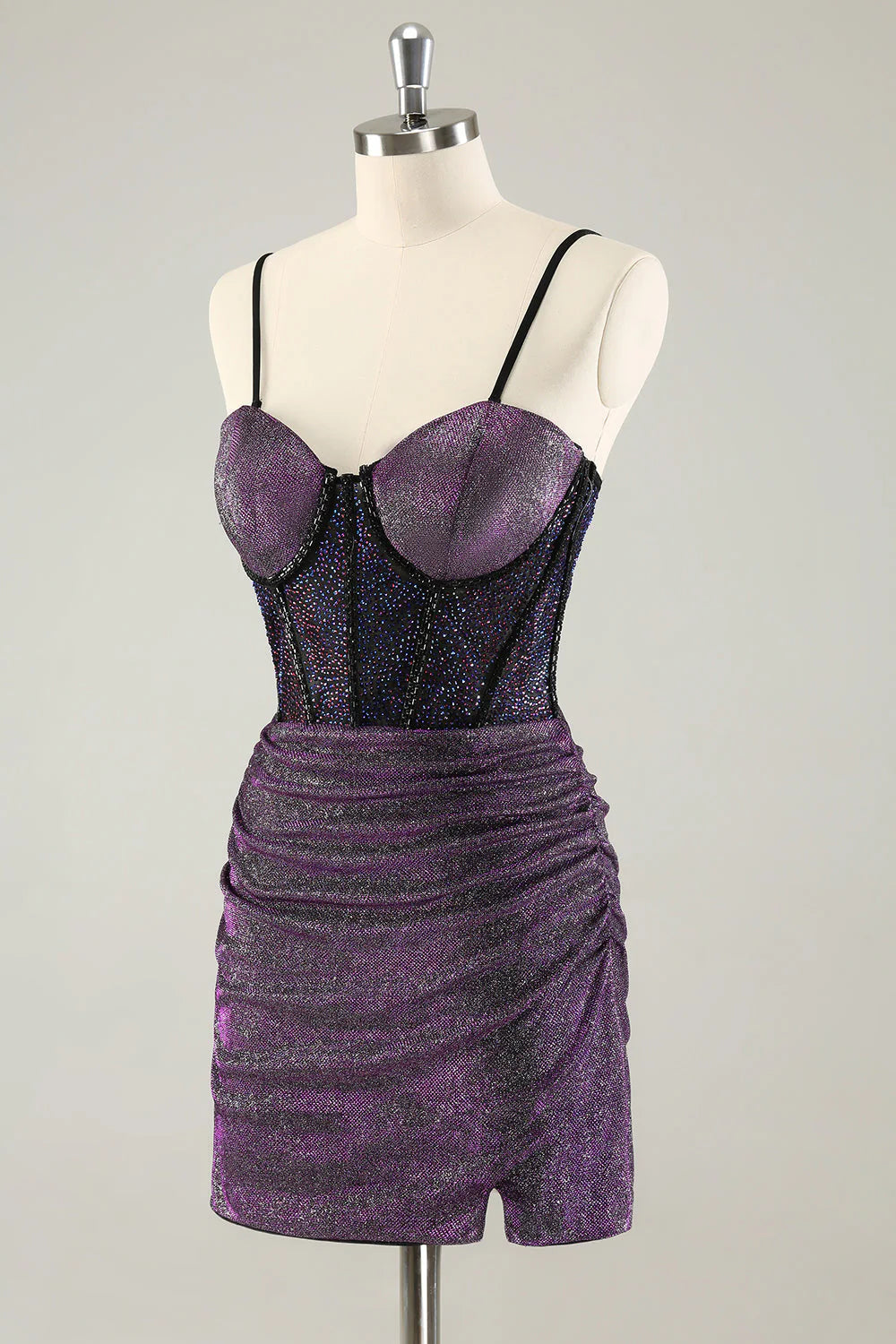 Side profile of a dark purple glitter short party dress.