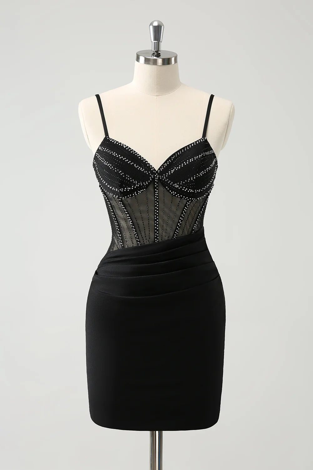 Model wearing a glitter black short homecoming dress with spaghetti straps and a corset bodice, front view.
