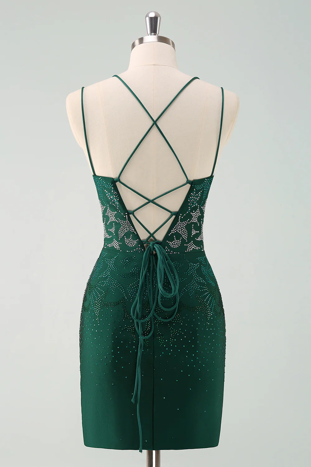 Side view of a model wearing the dark green glitter strapless dress.