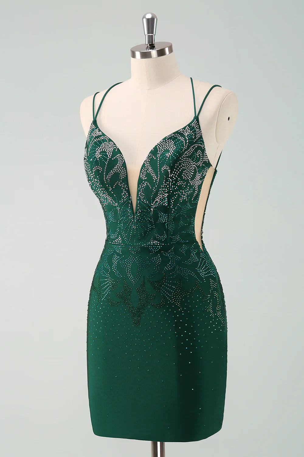 Back view of the dark green glitter dress, highlighting the lace-up detail.