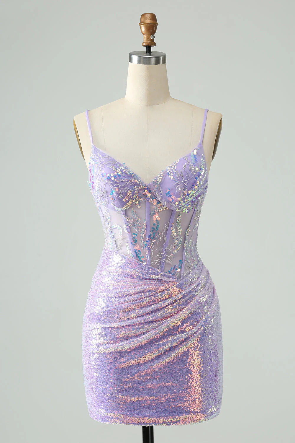 Model wearing a lilac glitter sequin short homecoming dress with spaghetti straps.