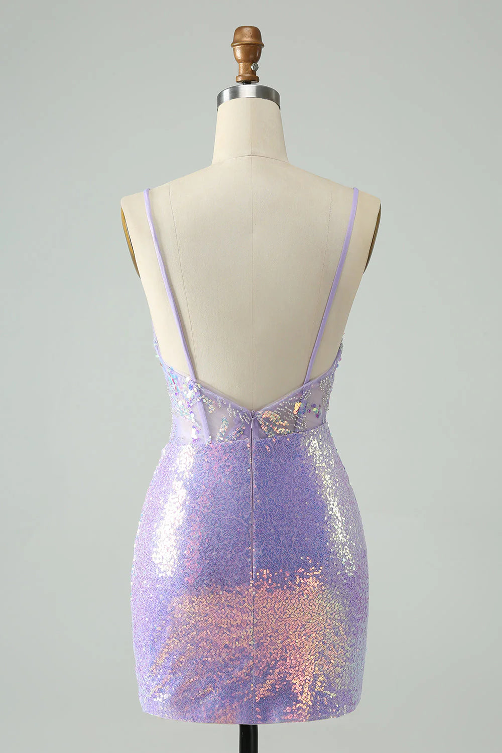 Back view of a model in a lilac sequin A-line homecoming dress.