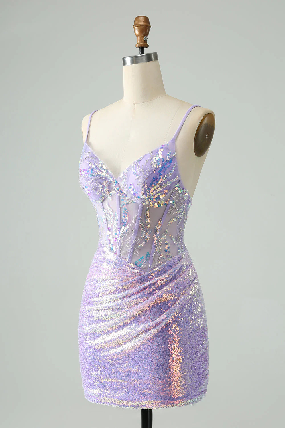 Side profile of a model showcasing a short lilac glitter formal dress.
