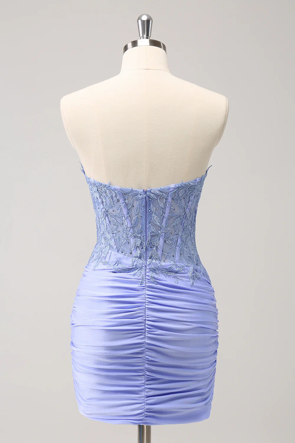 Side view of the pleated short lilac homecoming dress with sparkling details.