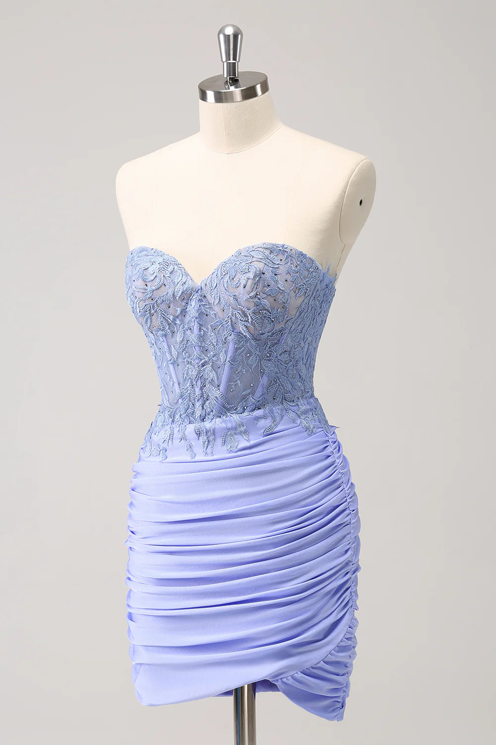 Back view of the strapless lilac homecoming dress, showcasing the pleated skirt.