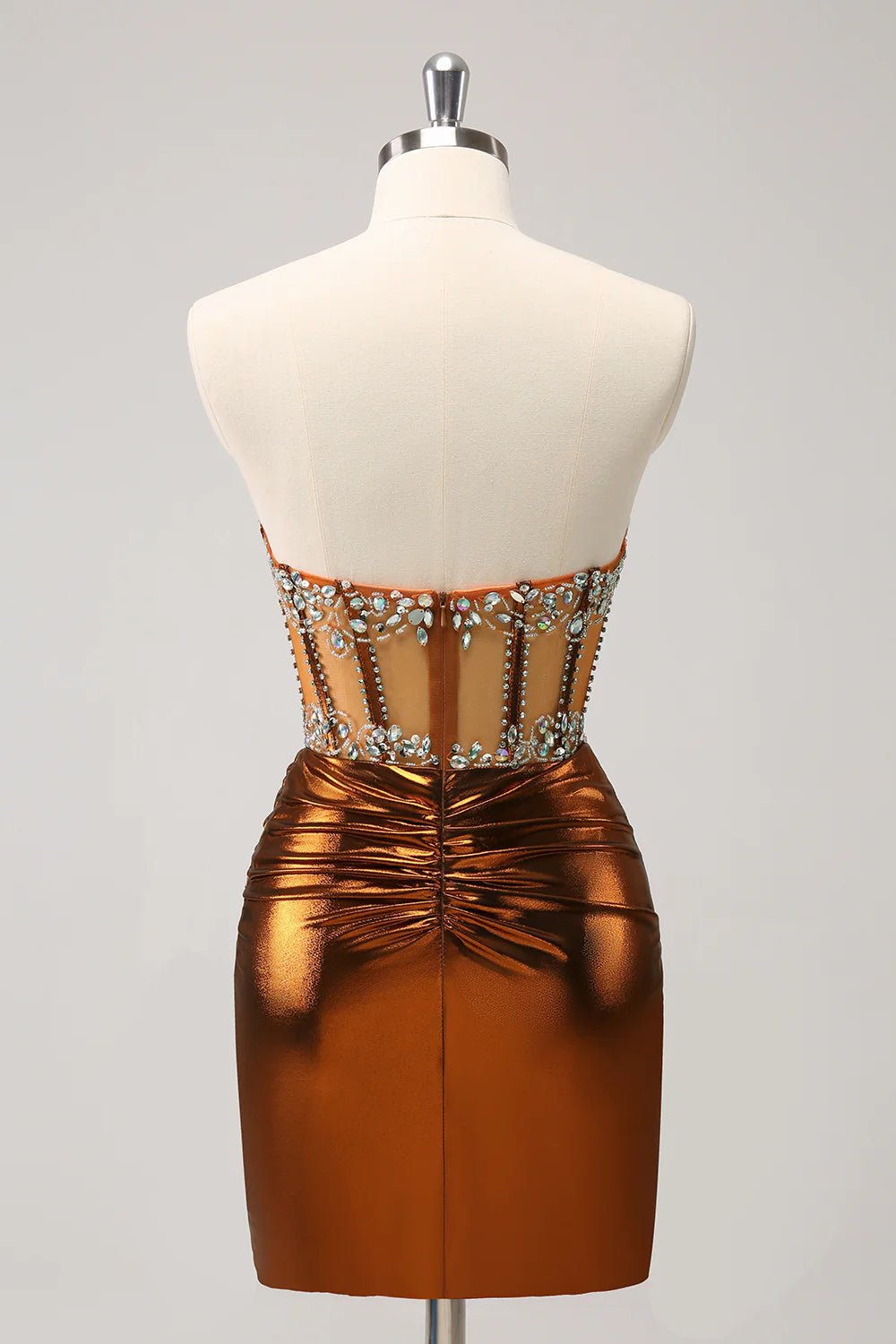 Side view of a glittering copper strapless corset short homecoming dress with beading.