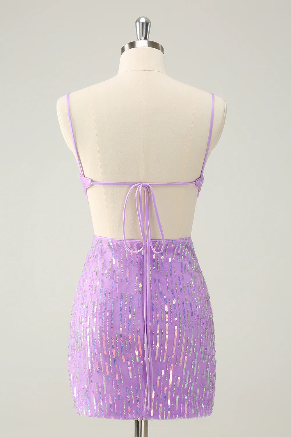 Back view of glitter purple bodycon dress showing lace-up detail.