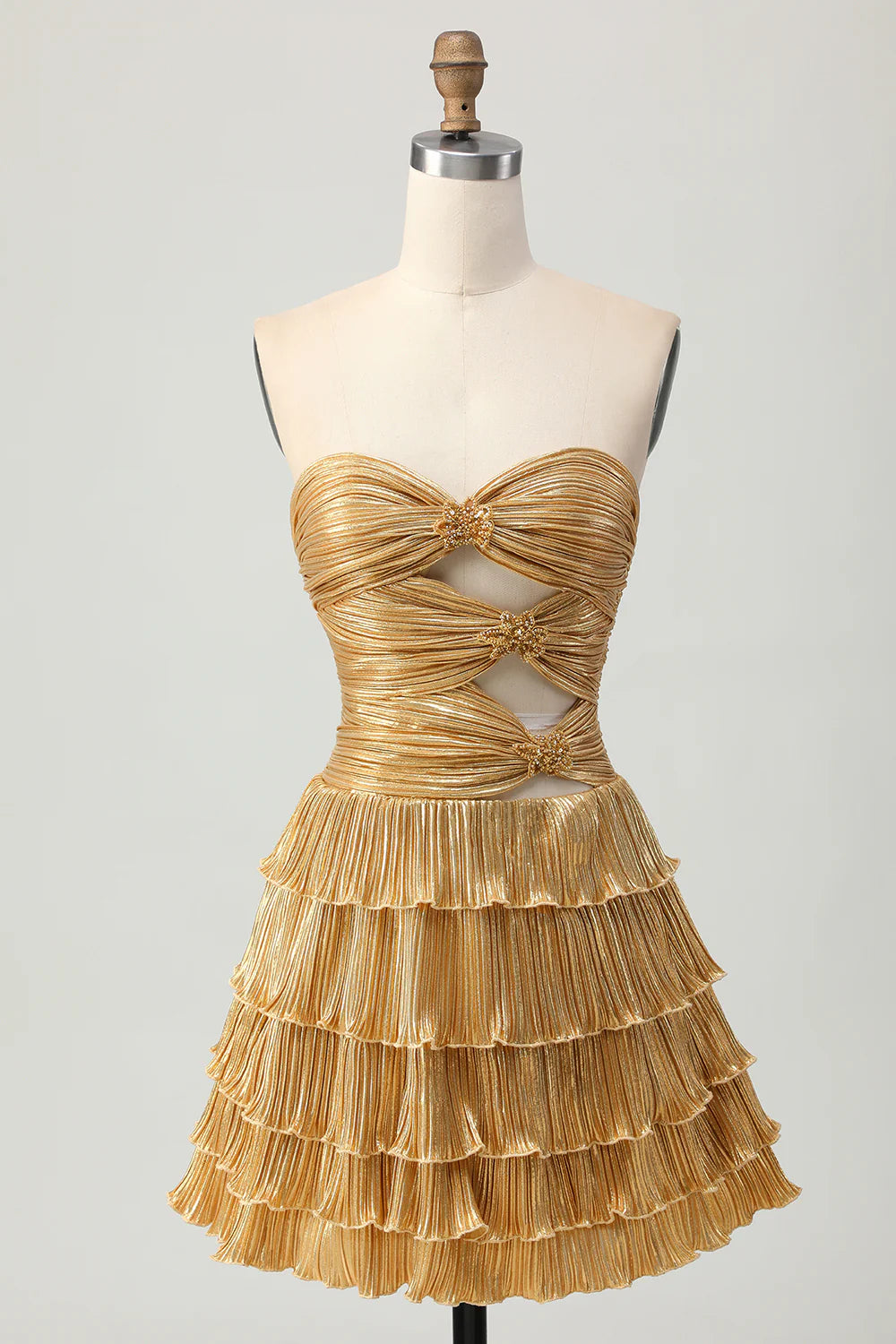 Golden tiered A-line strapless homecoming dress with cut-out and pleated details.