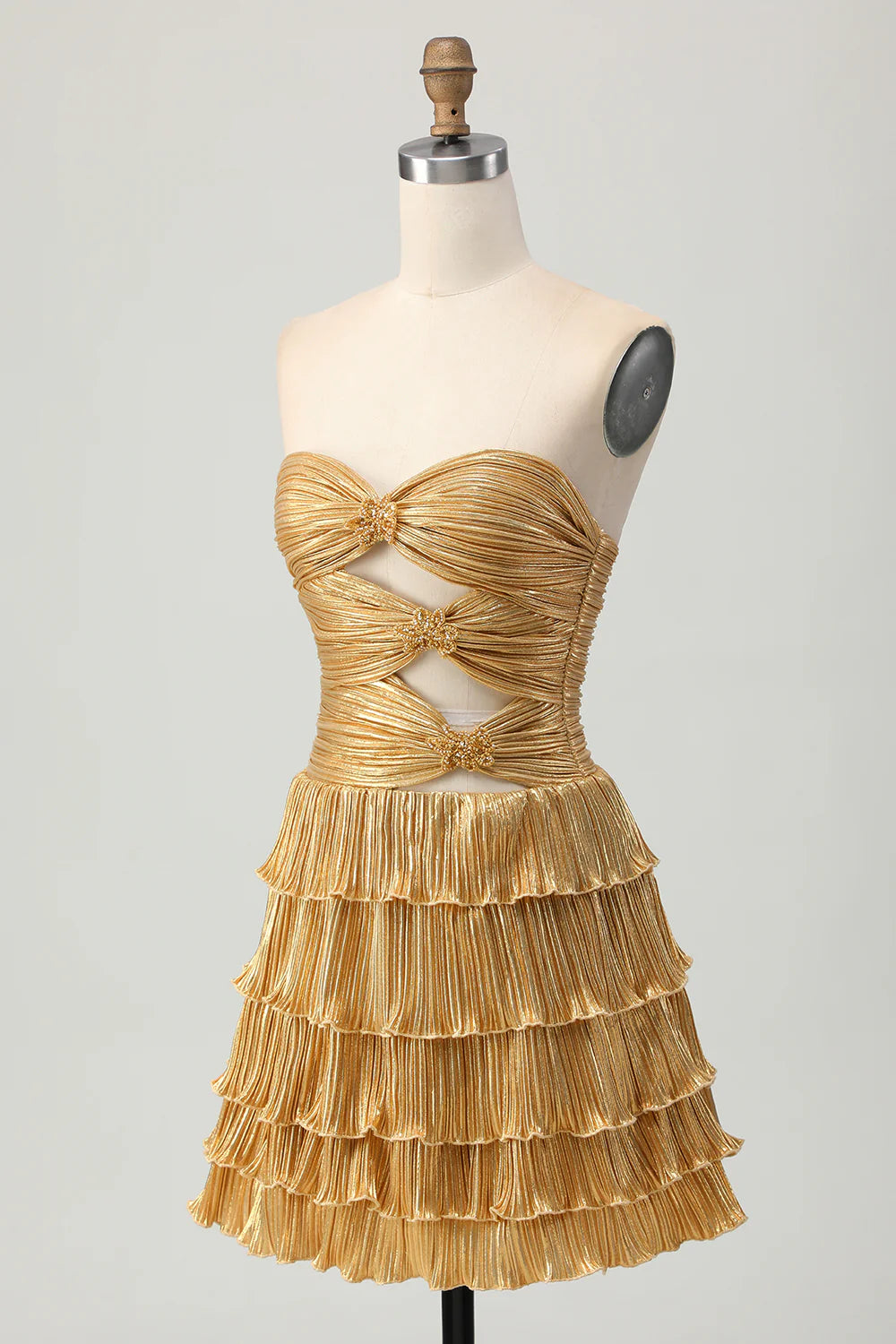 Side view of the golden tiered A-line strapless homecoming dress, showcasing pleats.