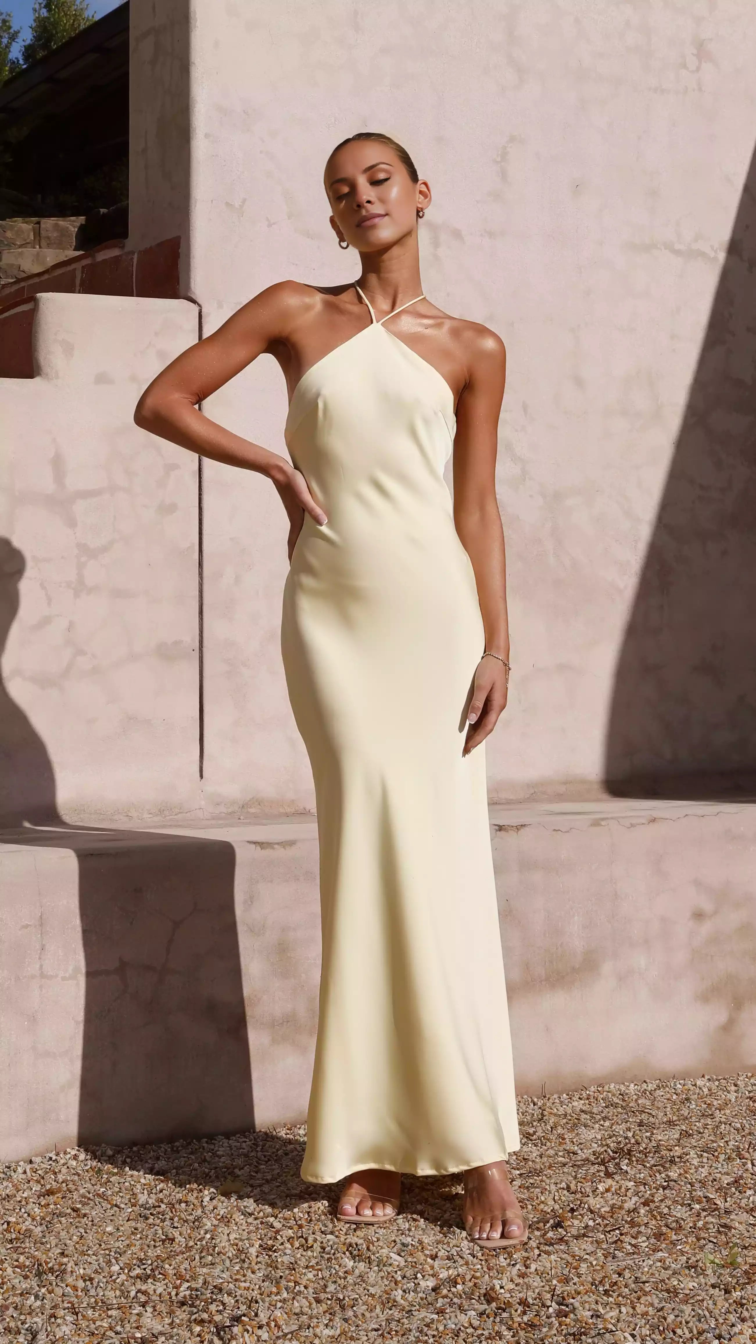 Gorgeous camisole style neckline with cross ties, backless, fully lined skirt that hangs to the ground Prom Dresses