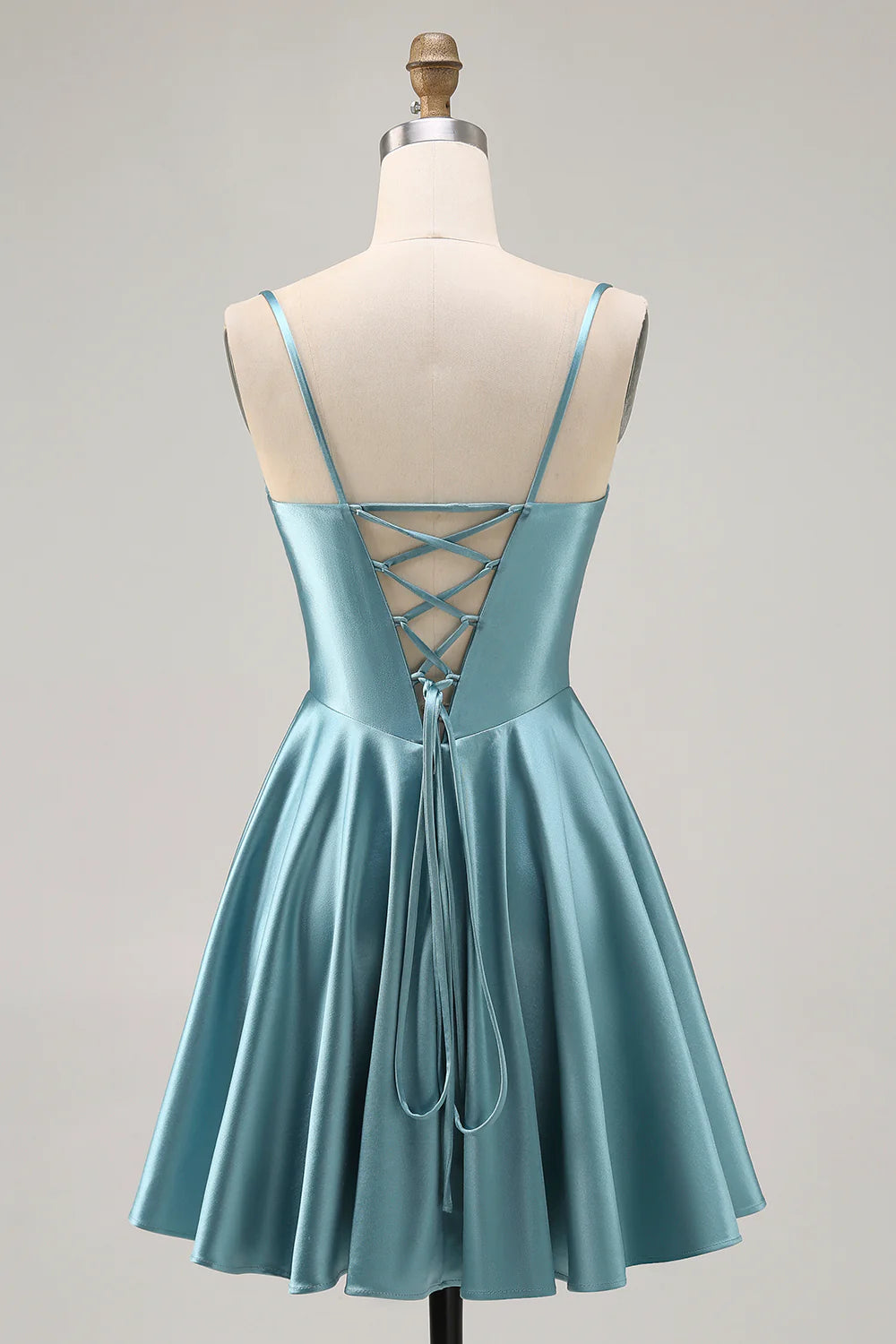 Back view of a grey green A-line satin homecoming dress showing the lace-up detail.