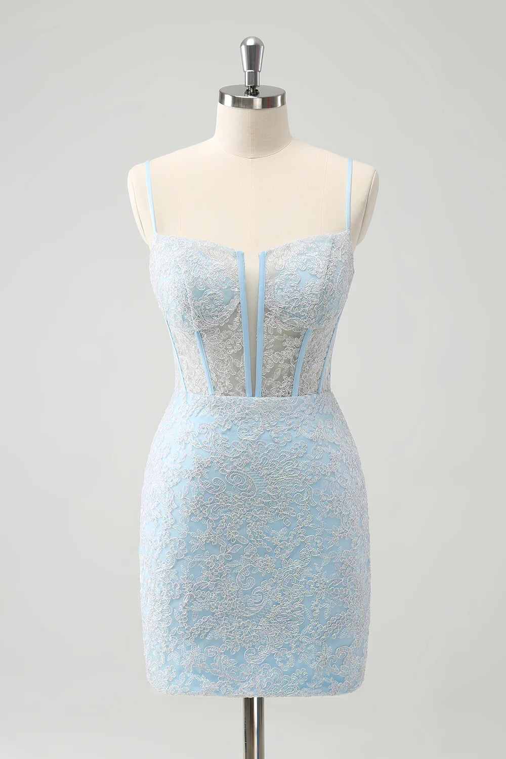 Model wearing a light blue corset spaghetti strap short homecoming dress.