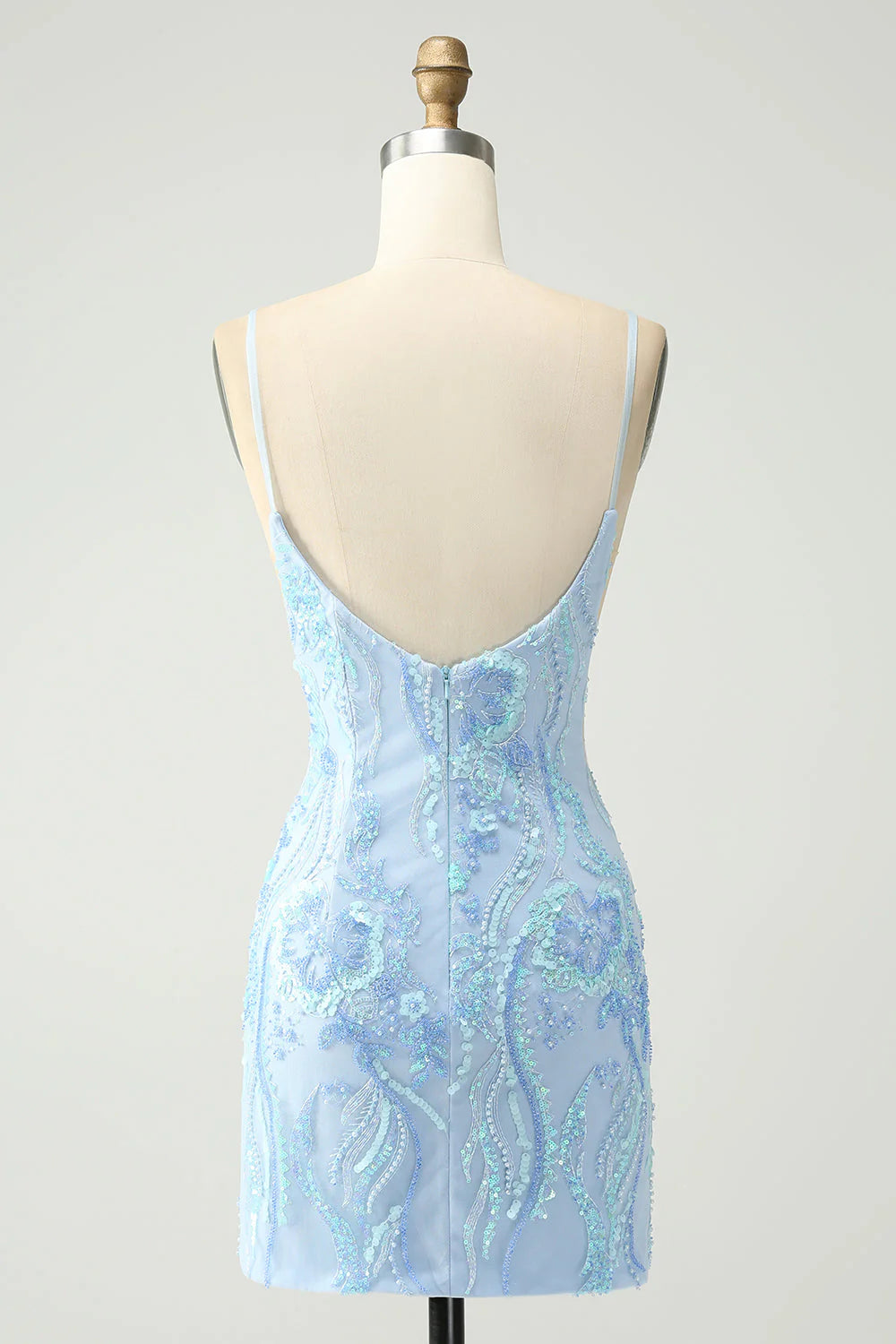 Side view of a model in a light blue sequin spaghetti strap short dress.