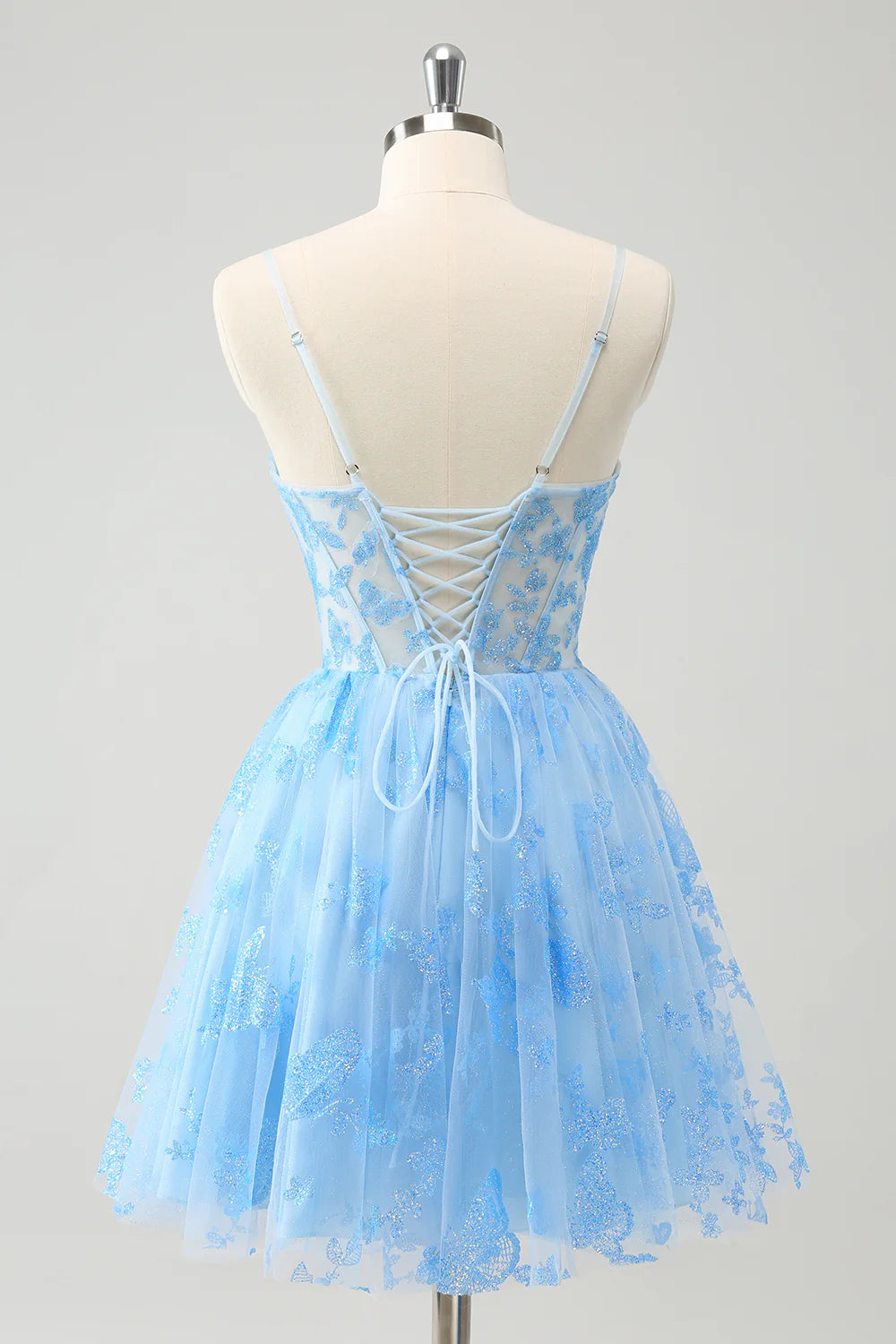 Side view of a blue strapless A-line dress featuring glow-in-the-dark butterflies.
