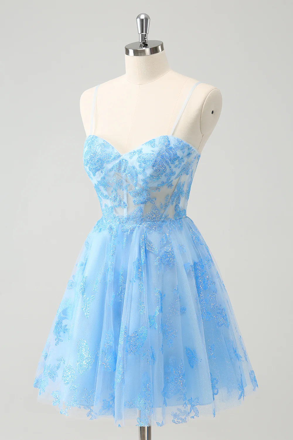 Back view of an elegant ankle-length blue homecoming gown with butterfly details.