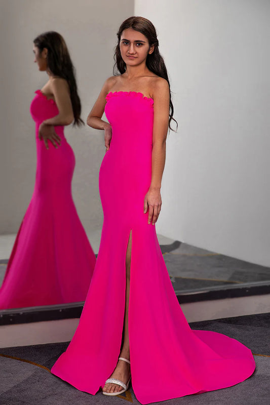 A fitted pleated waist cinched strapless side slit ball dress