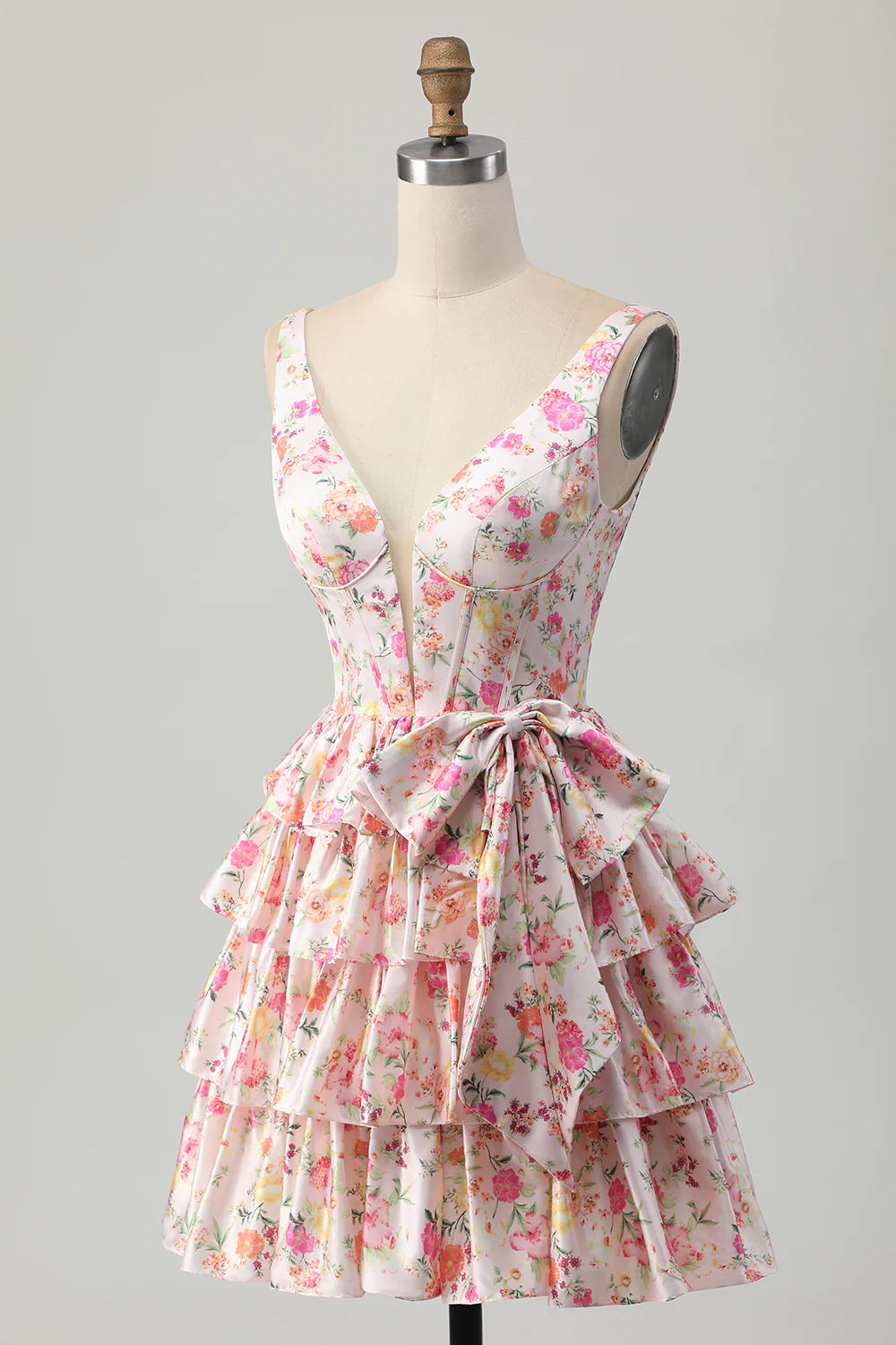 Close-up of the pink floral print and bow detail on the A-line dress.