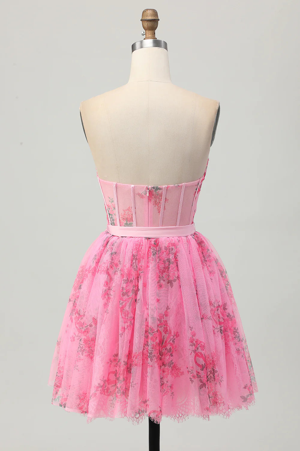 Back view of pink floral strapless A-line short homecoming dress.