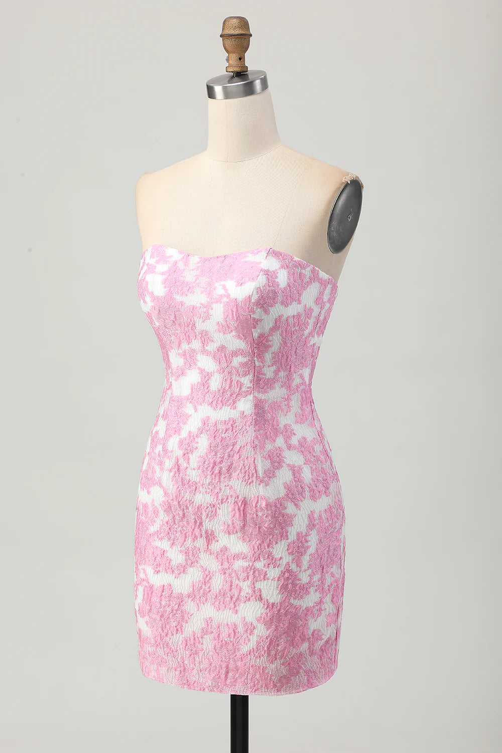 Full view of the tight pink printed formal dress.