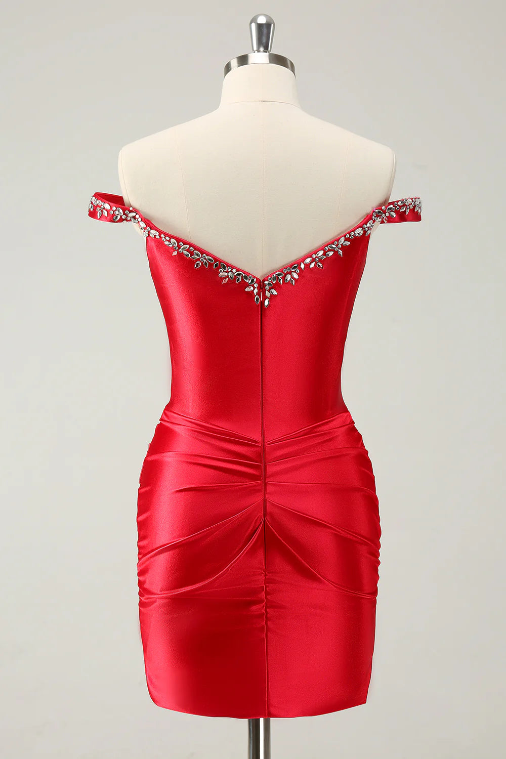 Side view of the red off-shoulder homecoming dress, showcasing the sheath silhouette.