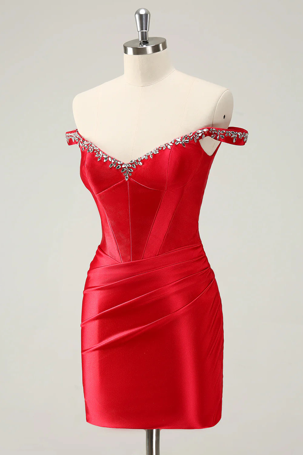 Close-up of the pleated corset and sparkling rhinestones on the red homecoming dress.