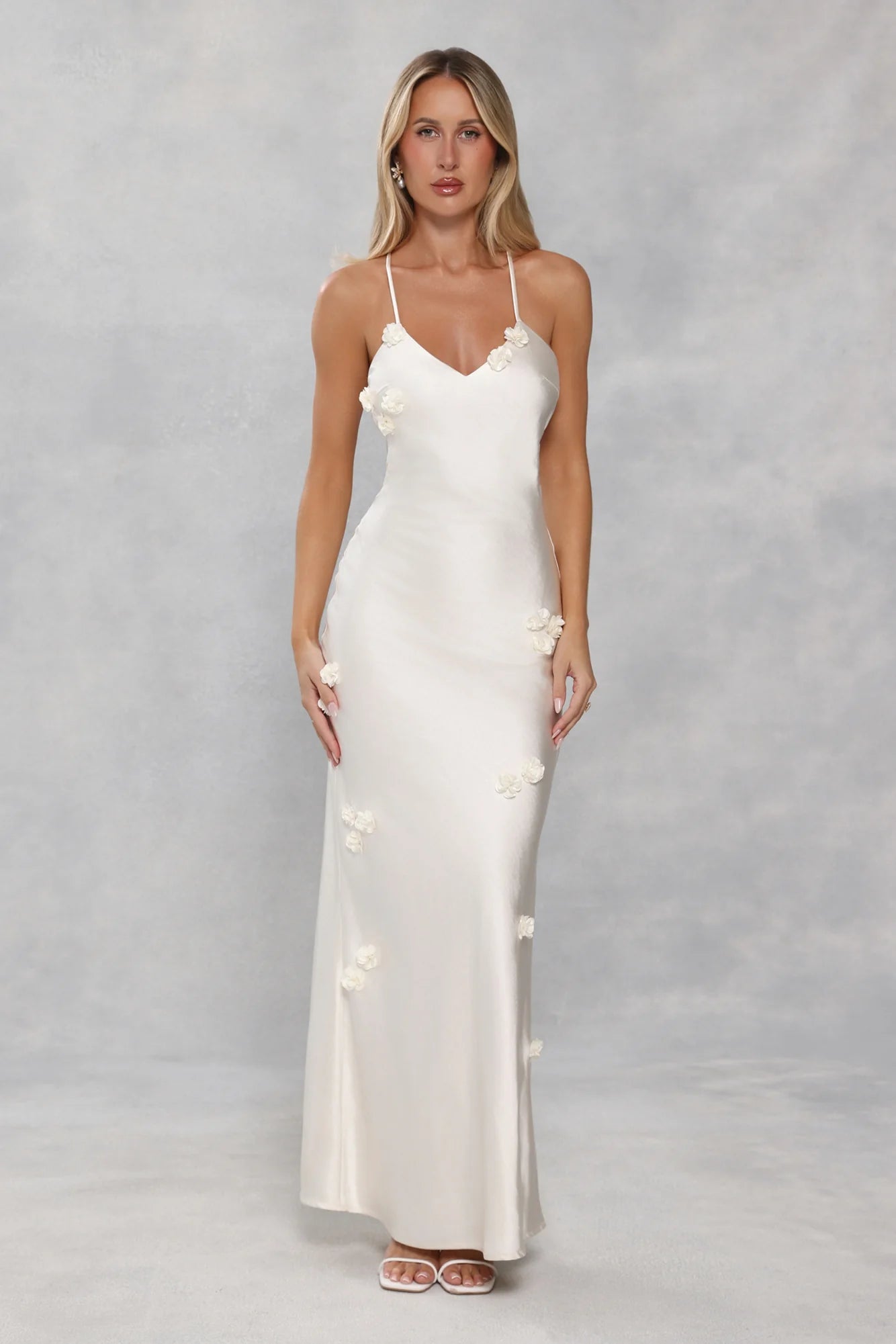 Romantic Ivory Satin Maxi Dress with 3D Floral Appliqués, Crisscross Strappy Open Back and Form-Fitting Silhouette